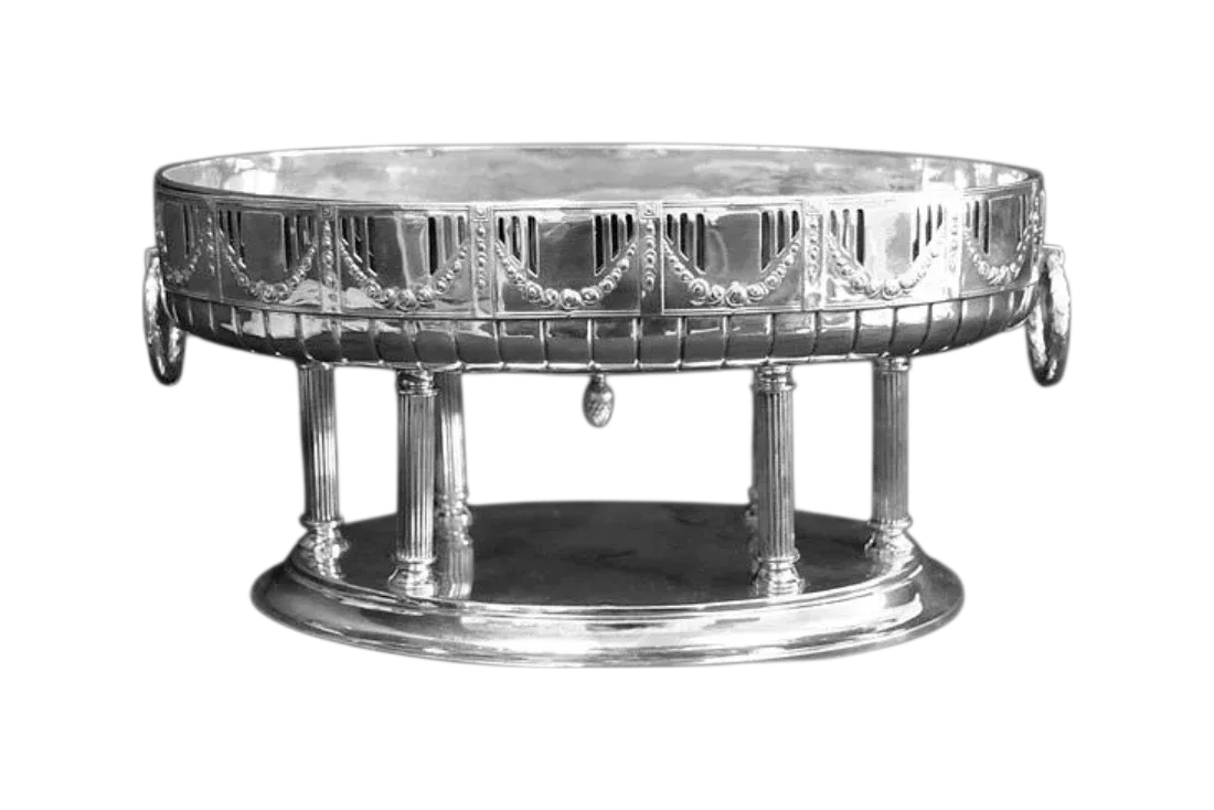 Antique sterling silver centerpiece bowl with decorative pierced gallery, column supports, and classical neoclassical design.