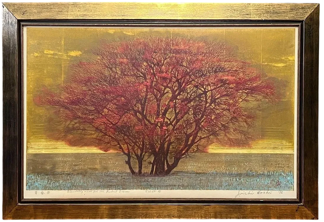 Framed Japanese woodblock print by Joichi Hoshi featuring a red tree in bloom against a textured gold landscape.