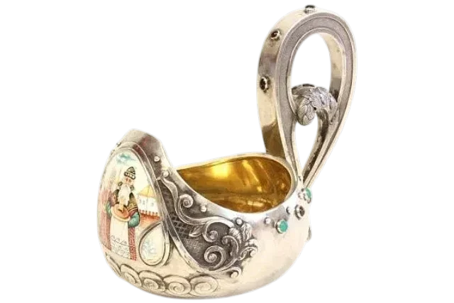 Antique Russian silver enameled kovsh with gilded interior, enamel figural decoration, and decorative scrolling handle.