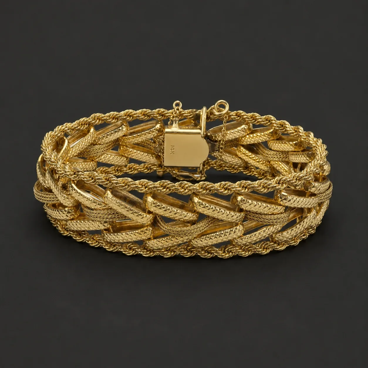 Vintage 14kt gold bracelet featuring textured curb links and rope chain detailing, recently acquired estate jewelry.