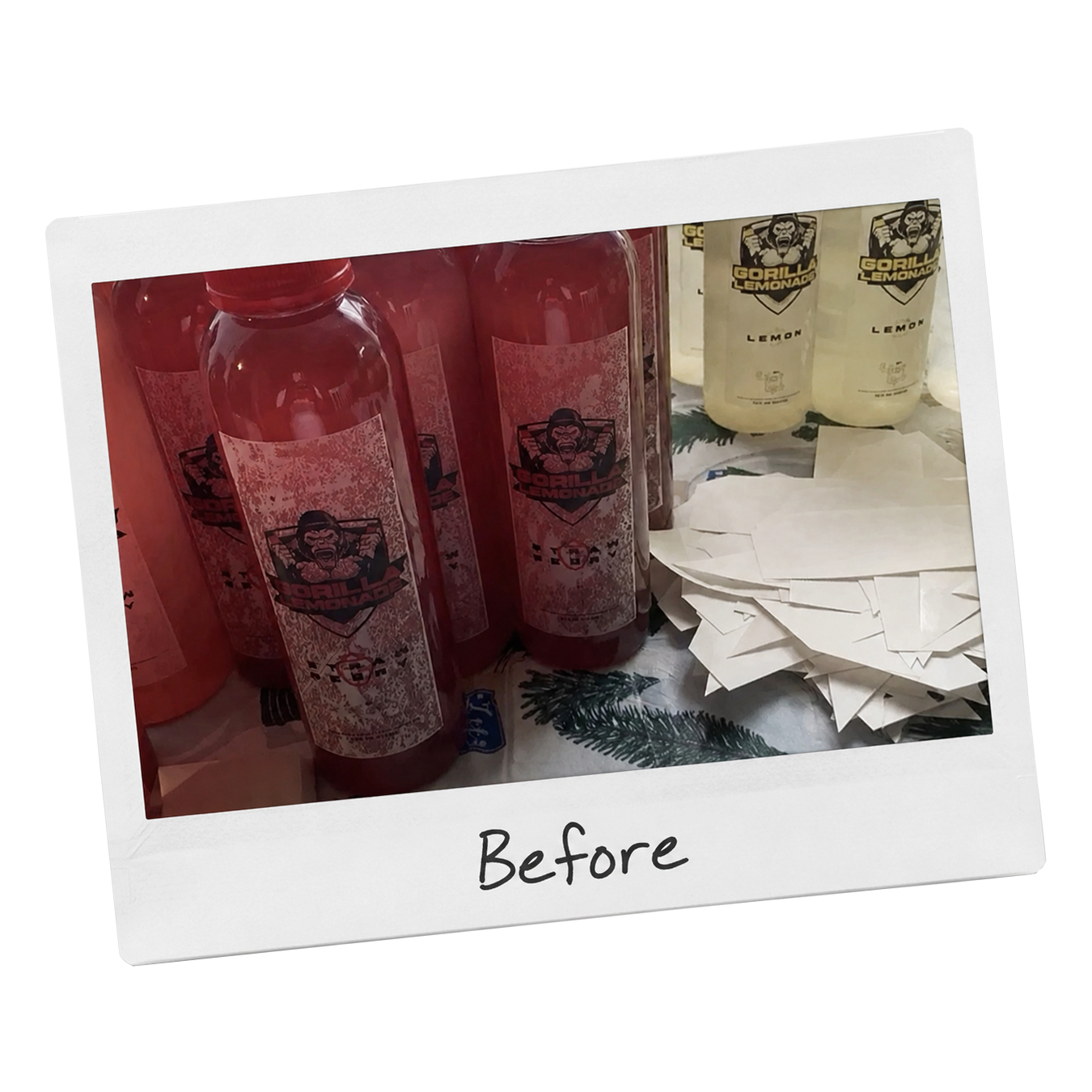Red and white bottles of Gorilla Lemonade on a table with paper napkins and green pine branch decorations, labeled 'Before'.