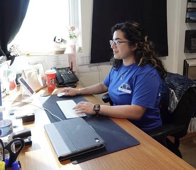 Office Manager working at desk