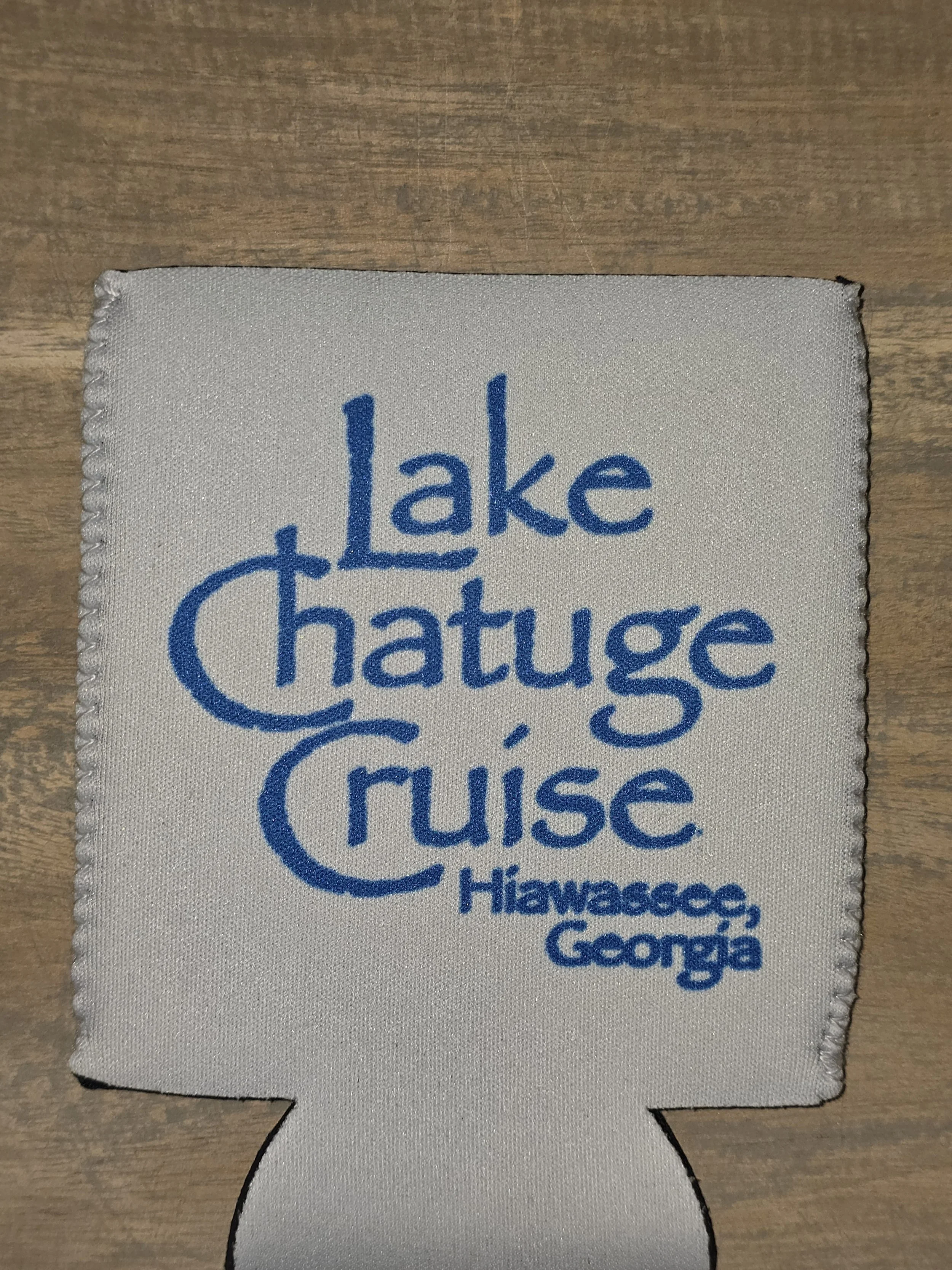 Cloth tag with blue writing that reads "Lake Chatuge Cruise Hiawassee, Georgia."