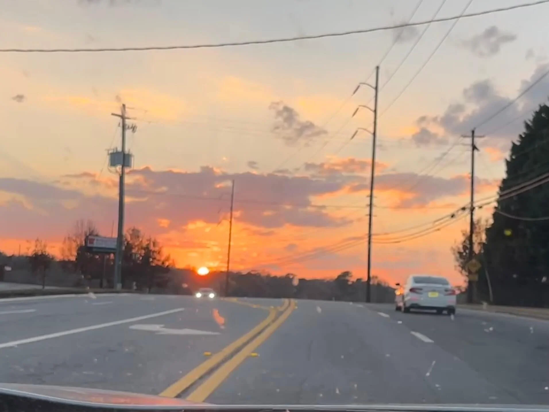 This is life - bugs on the windshield from a long day with a sunset hinting at the promise of another chance tomorrow.