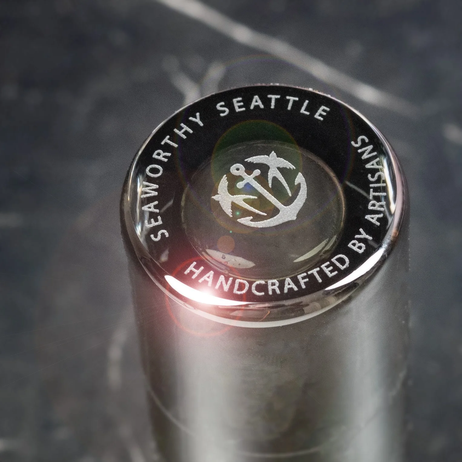 bottom logo on hand-blown and hand-polished glass jigger