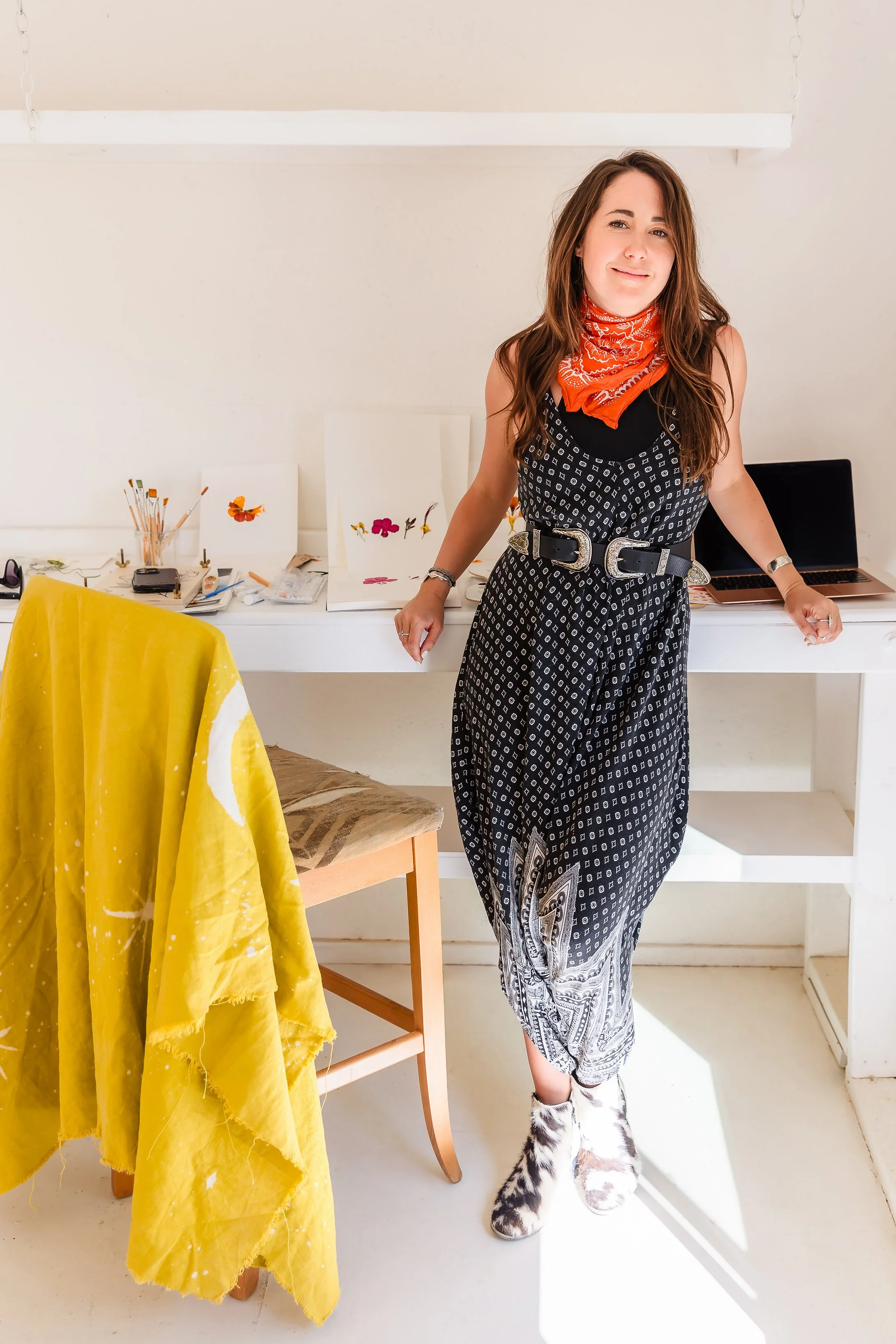 Caroline Mauro, founder, brand strategist and storyteller of REWOLF Creative, a Colorado brand strategist and creative storyteller, in her art studio.