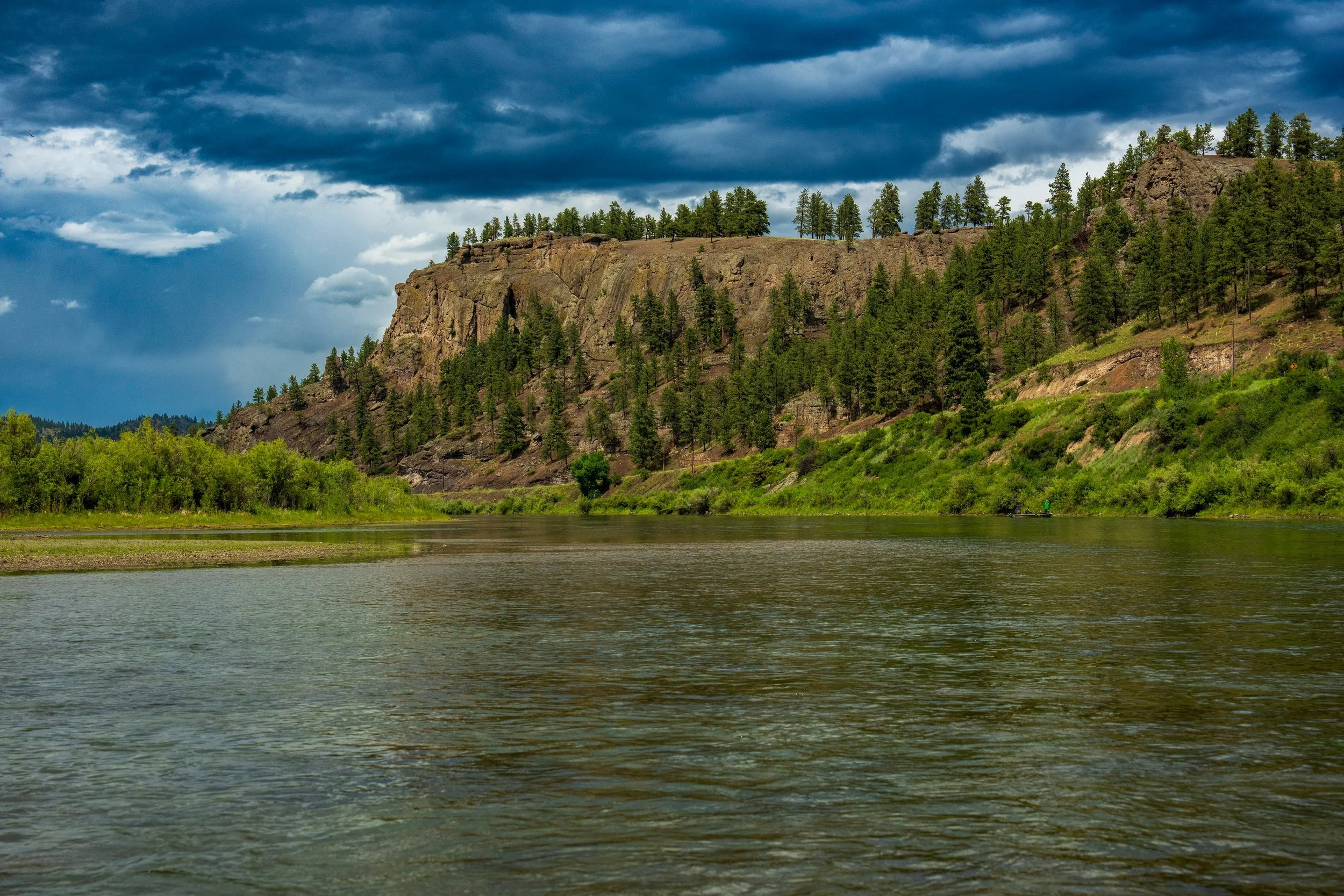 Rock bluffs above a river bend, Montana