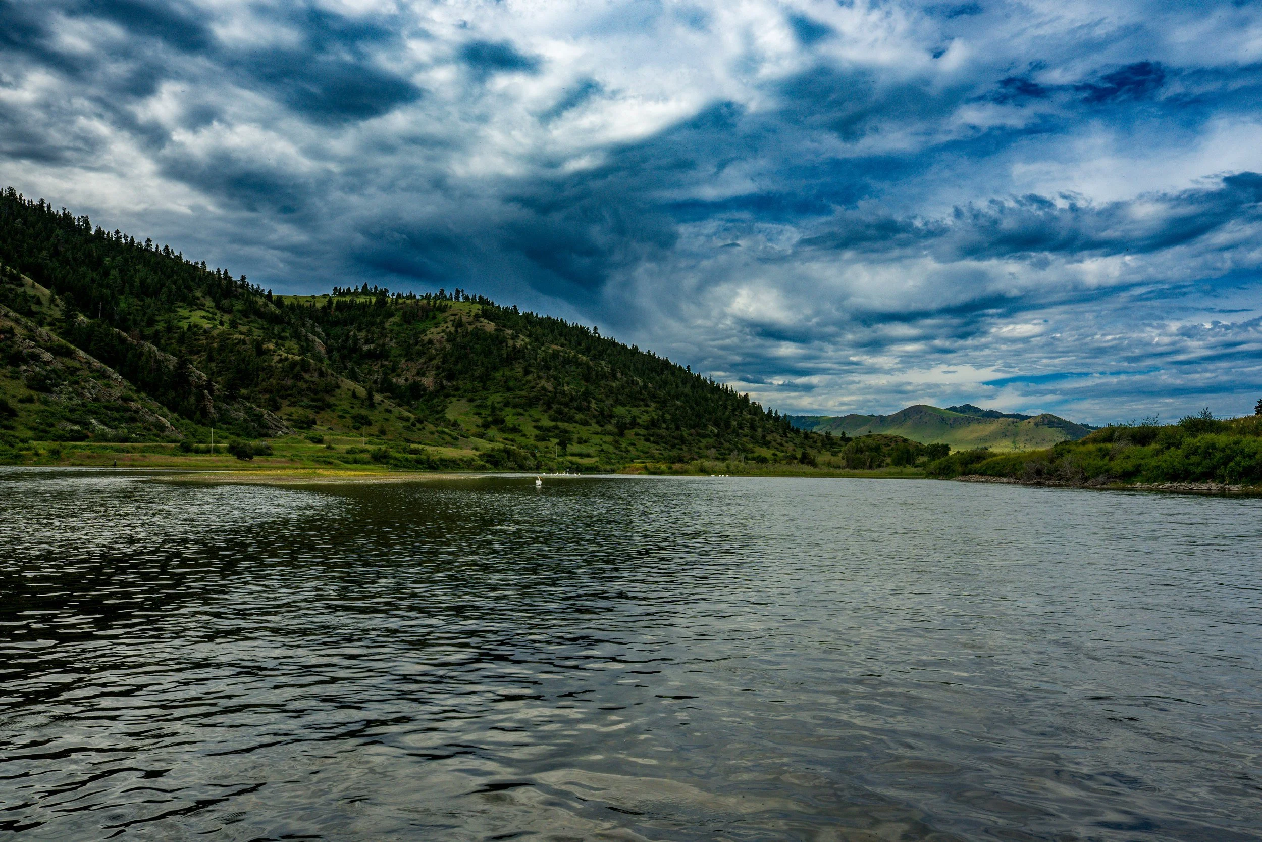 Storm clouds over a wide river, Montana