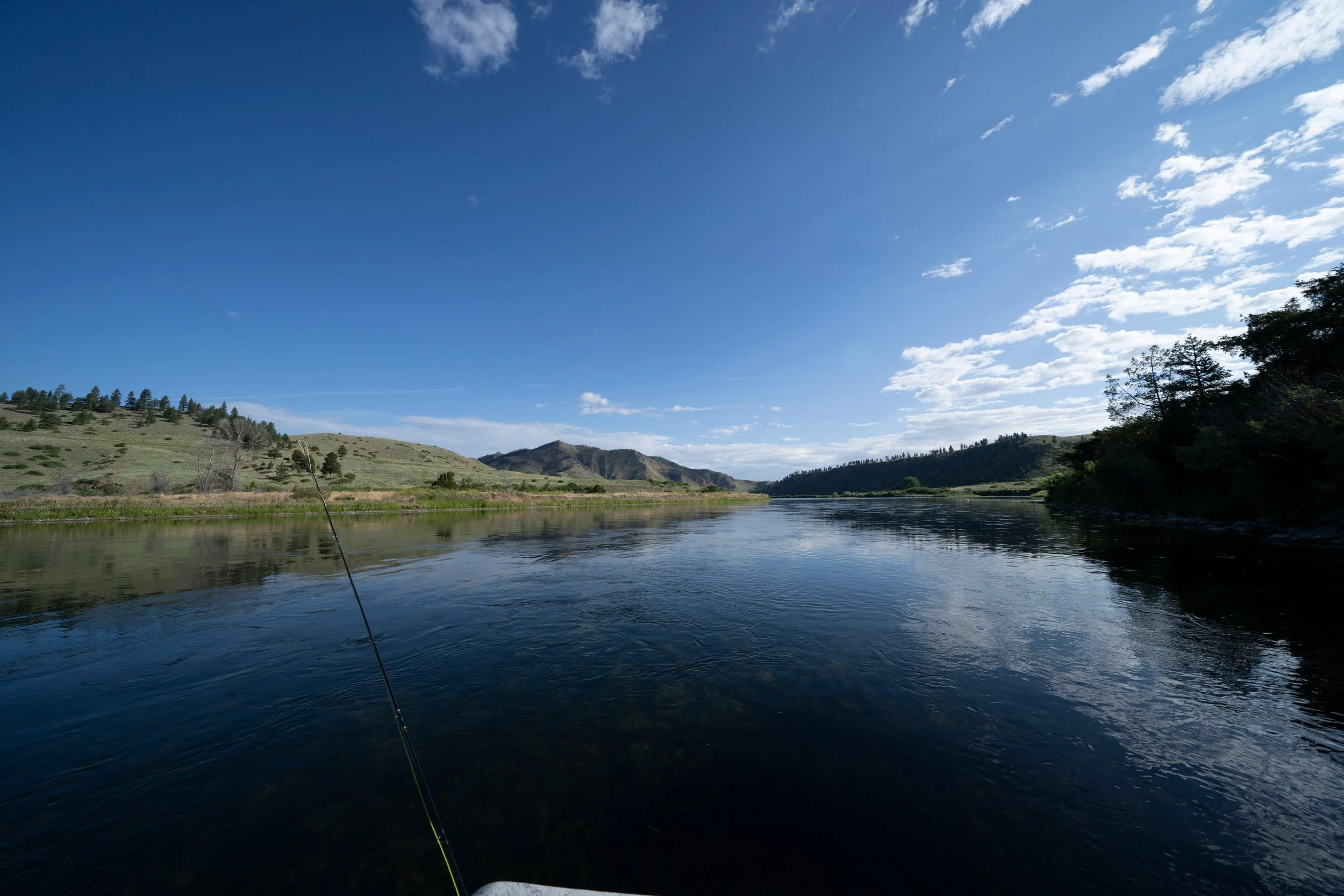 Calm river bend under streaky clouds, Montana