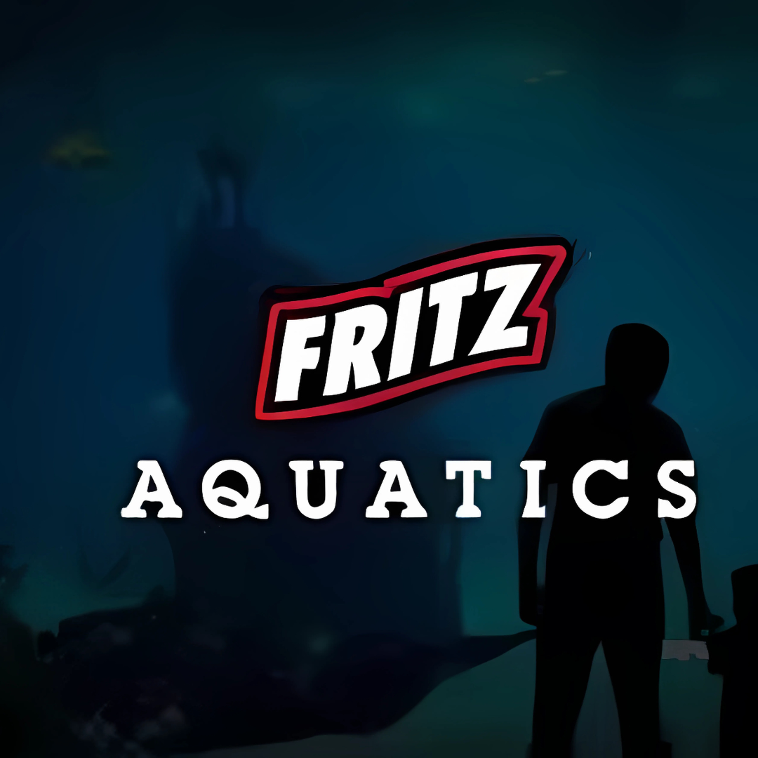 Silhouettes of a man and a child standing in front of a large aquarium with the 'Fritz Aquatics' logo on the glass.
