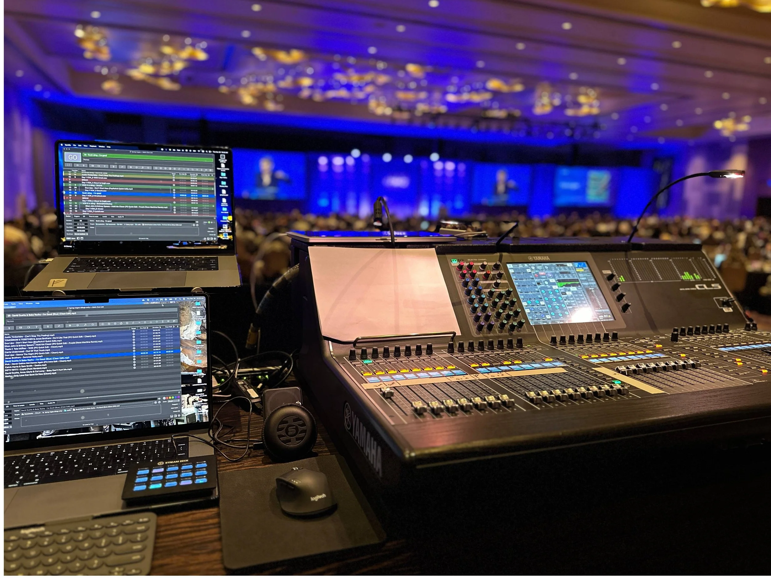 Sound console with computers at front of house for coporate event