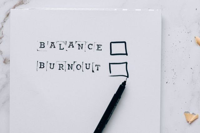 piece of paper with check boxes showing balance or burnout