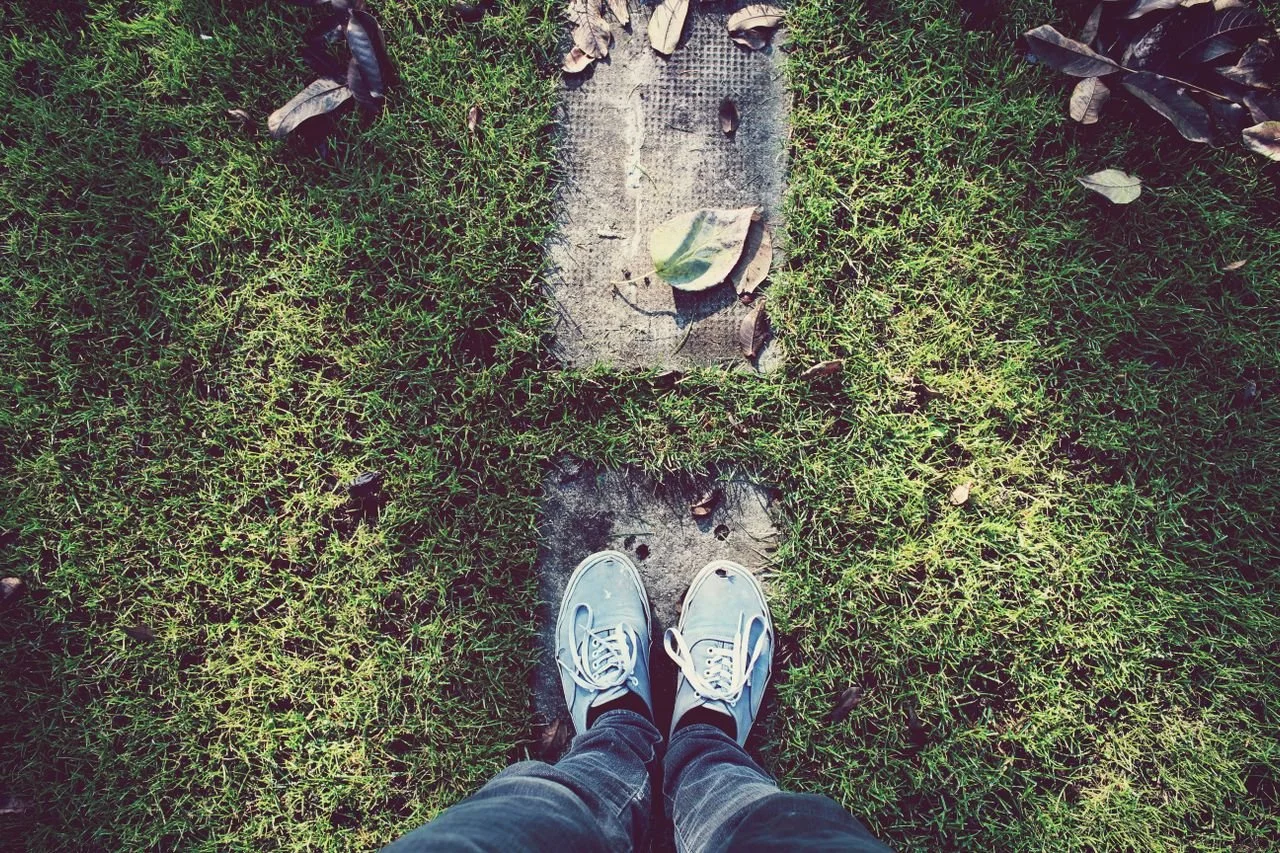 image of feet-about-to-step-on-path