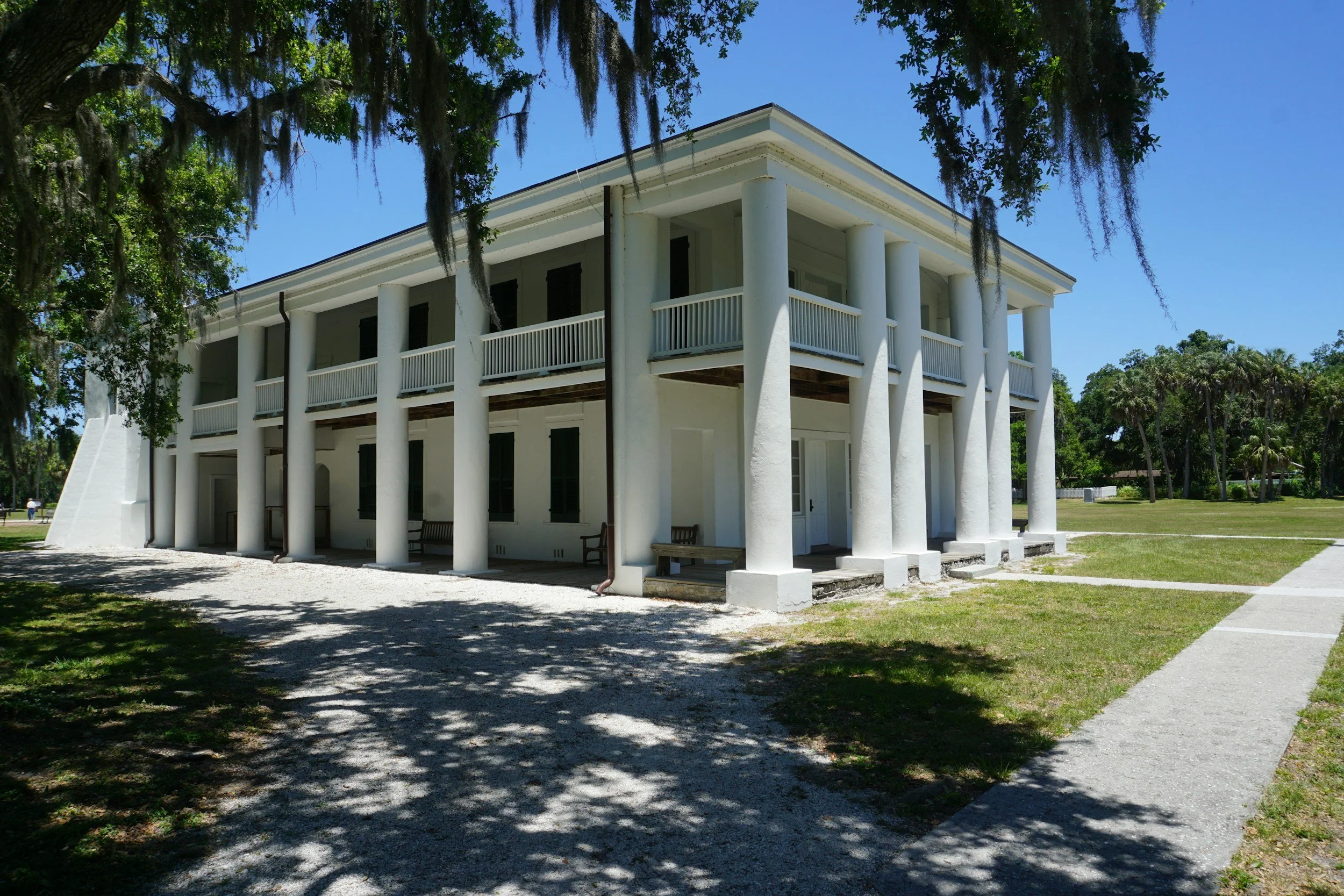 Hurricane-resistant home construction in Florida with reinforced structure and impact windows