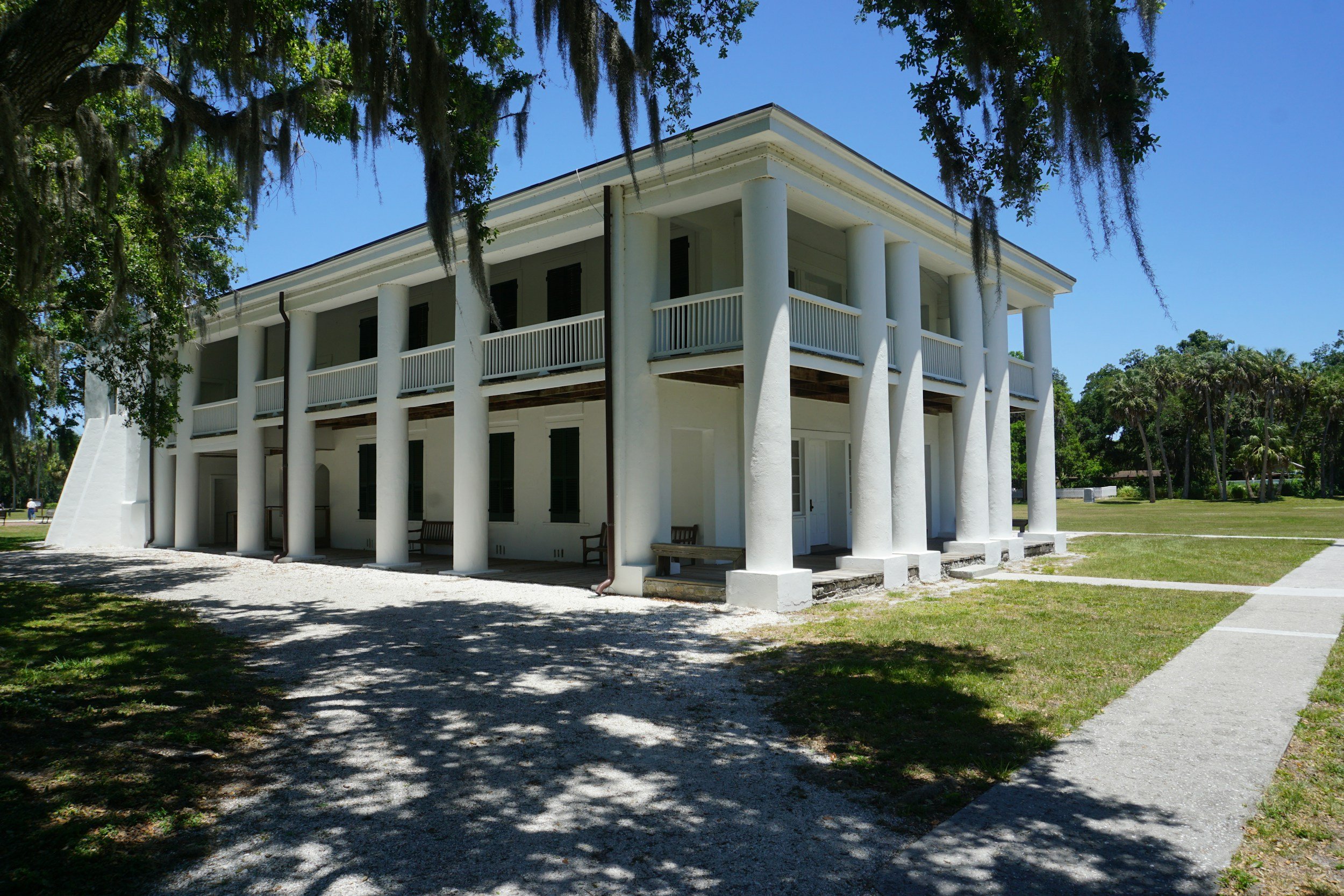 Hurricane-resistant home construction in Florida with reinforced structure and impact windows