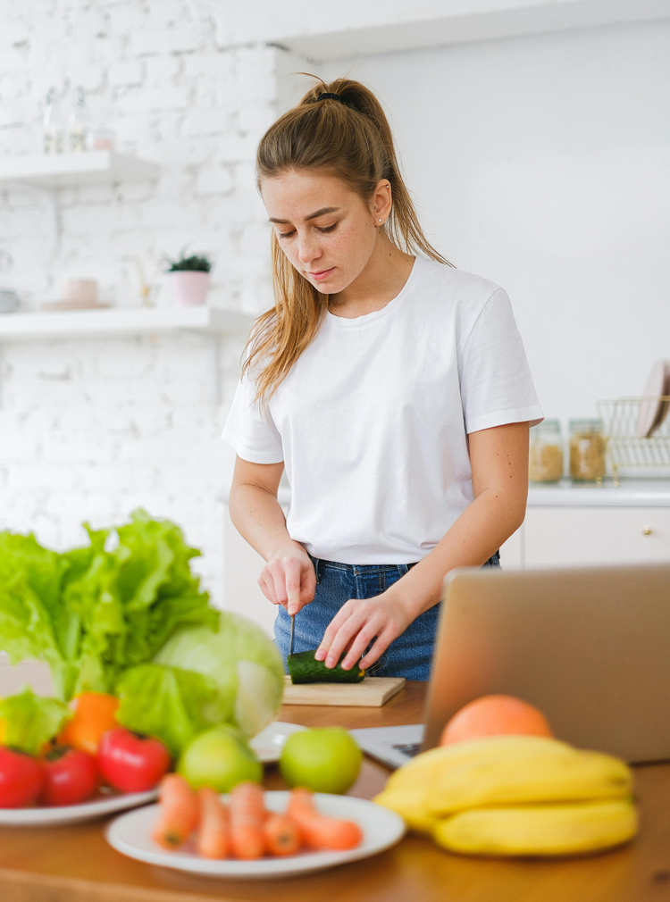 Nutritionist in Vancouver guiding client through healthy meal preparation