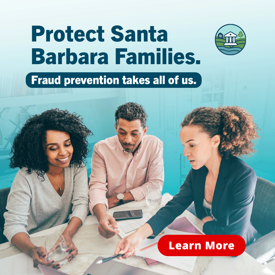 A group of three people in a meeting discussing documents with one woman pointing at a laptop, overlaid with text promoting fraud prevention and protecting families, with a logo of a community or neighborhood in the top right corner and a red 'Learn More' button.
