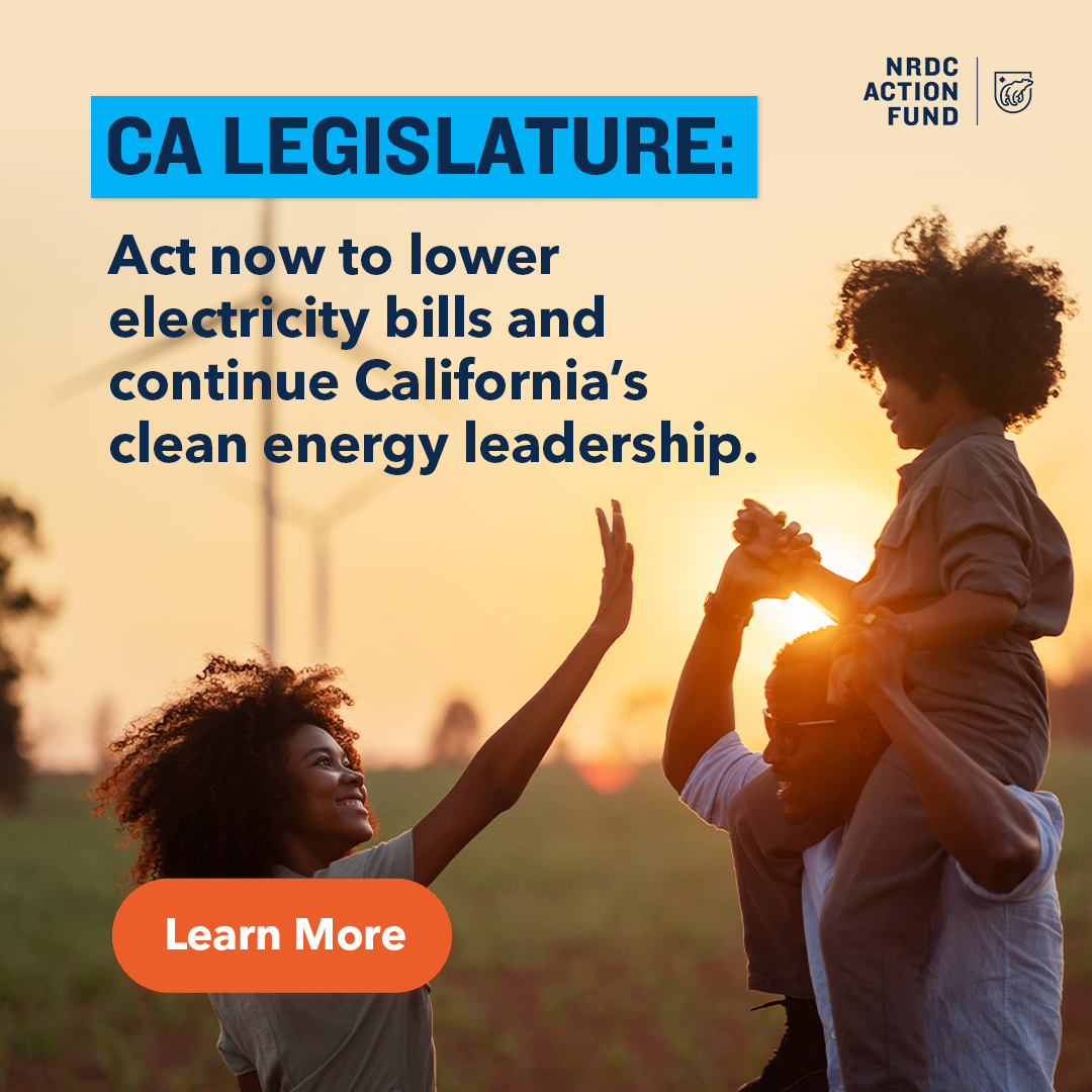 A family enjoying outdoor sunset, with a woman giving a high five to a woman holding a child on her shoulders, wind turbines in the background, promoting California legislation for clean energy and lower electricity bills.