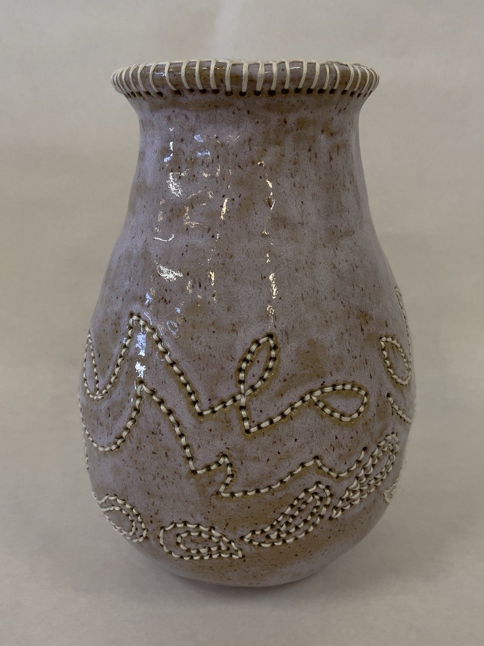 Dolly, 2025, Ceramic and embroidery floss, 9"x5"x6.5"
