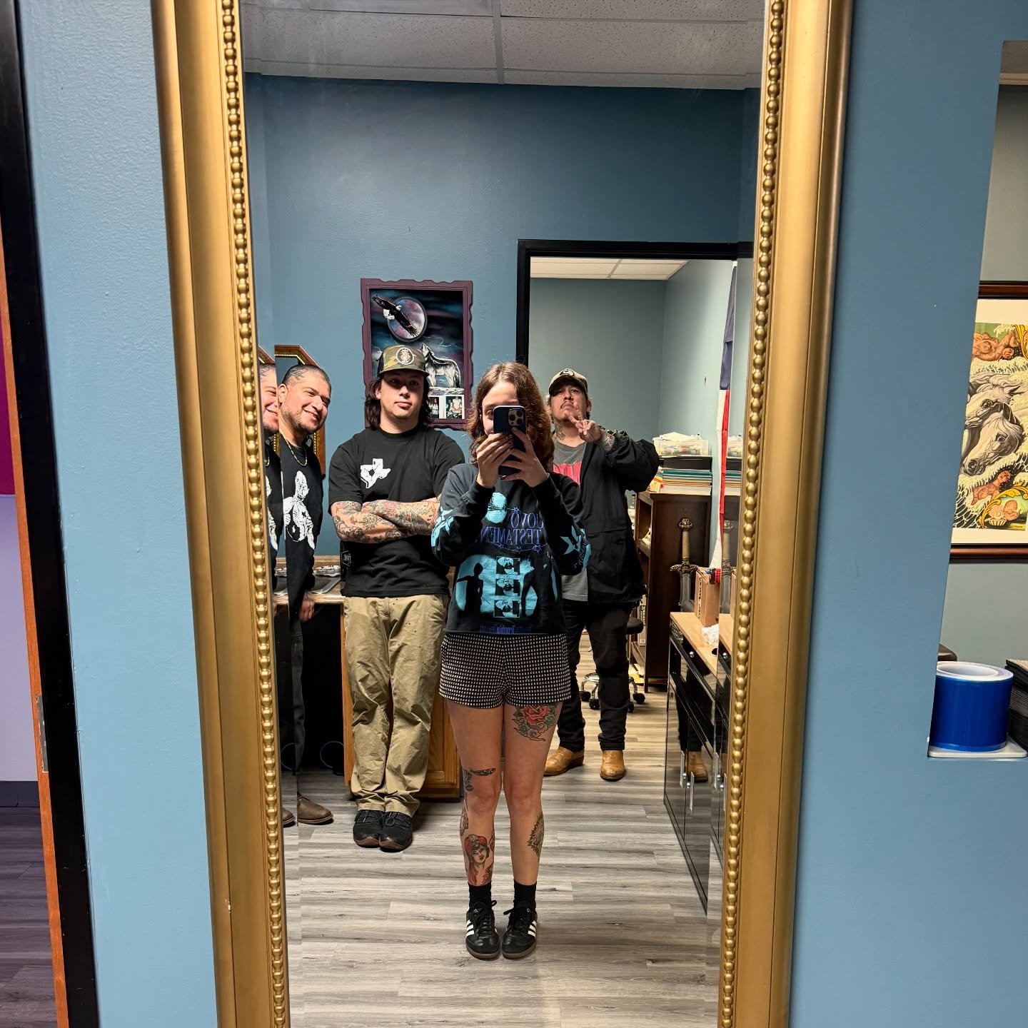 How many tattooers did it take to hang this mirror?