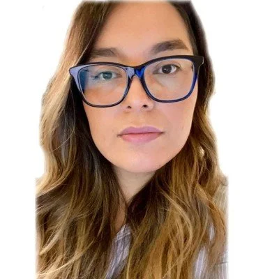 Woman with long hair and blue glasses