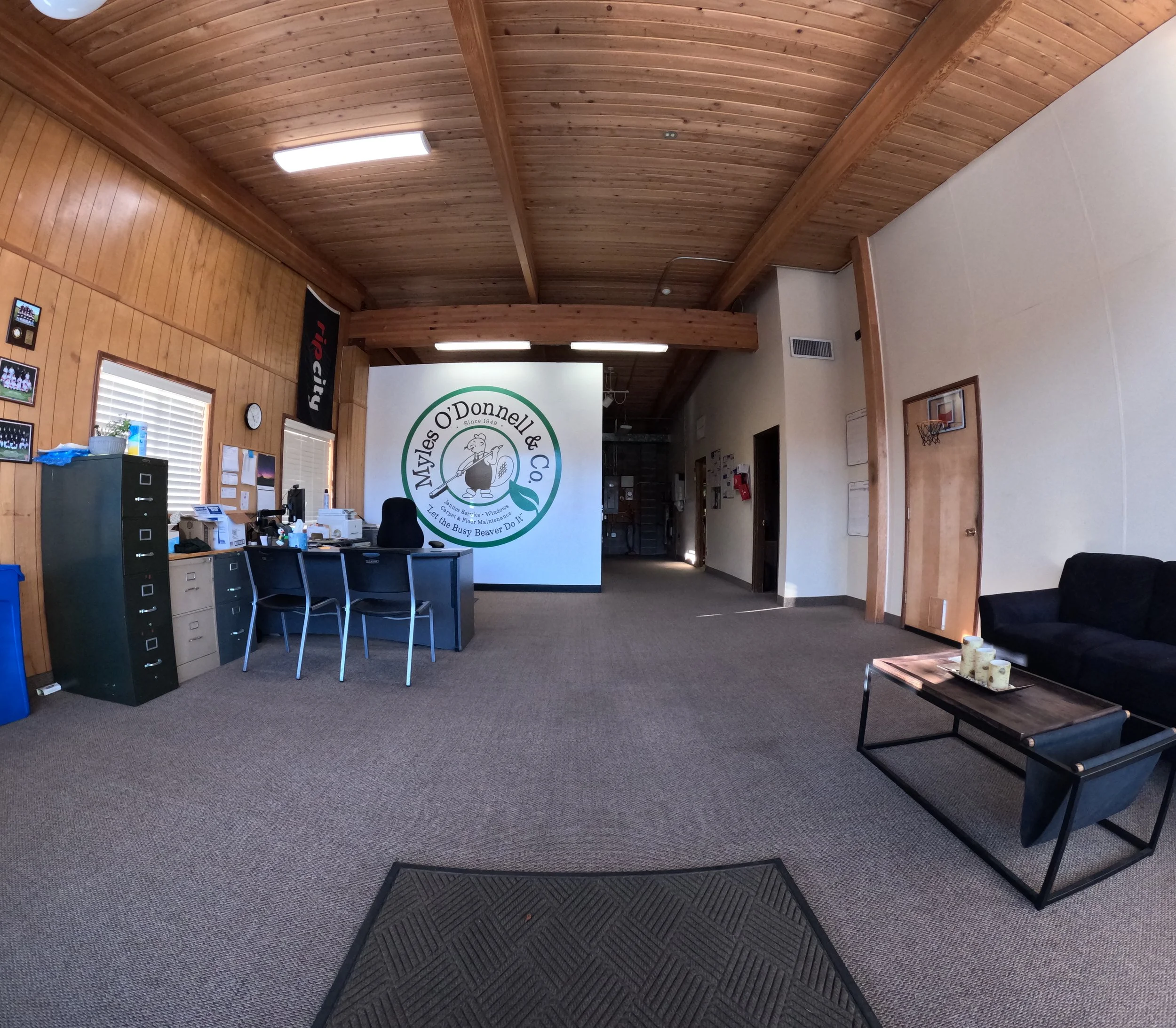 a wide angle shot of the interior of Myles O'Donnell's office, facing in