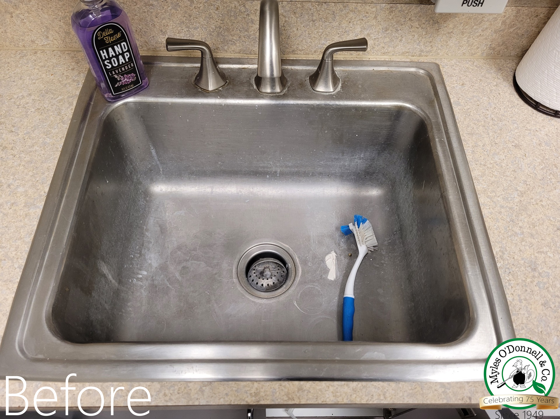 a dirty and scaley kitchen sink, before being cleaned