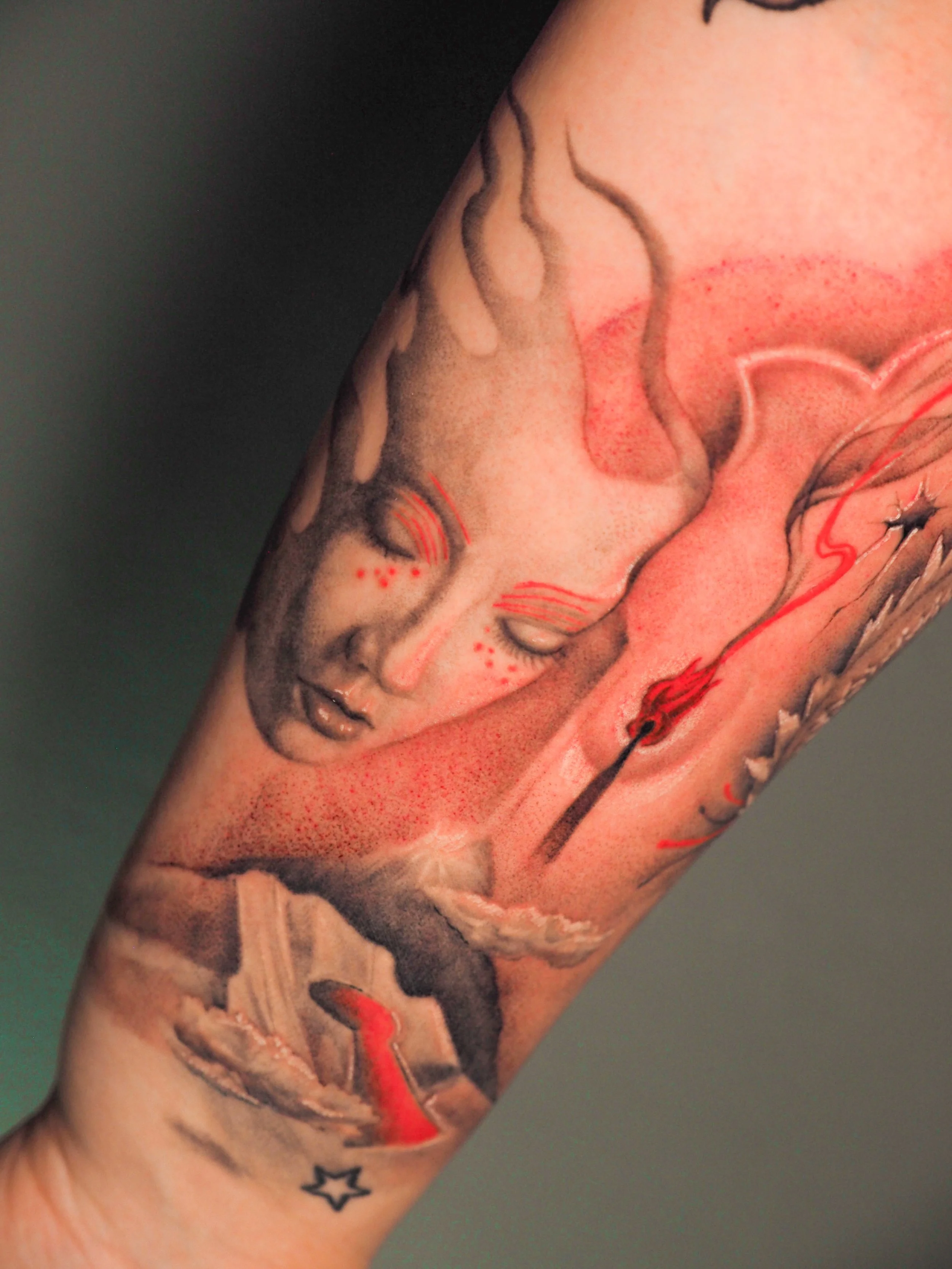 surreal custom design tattoo with red accents