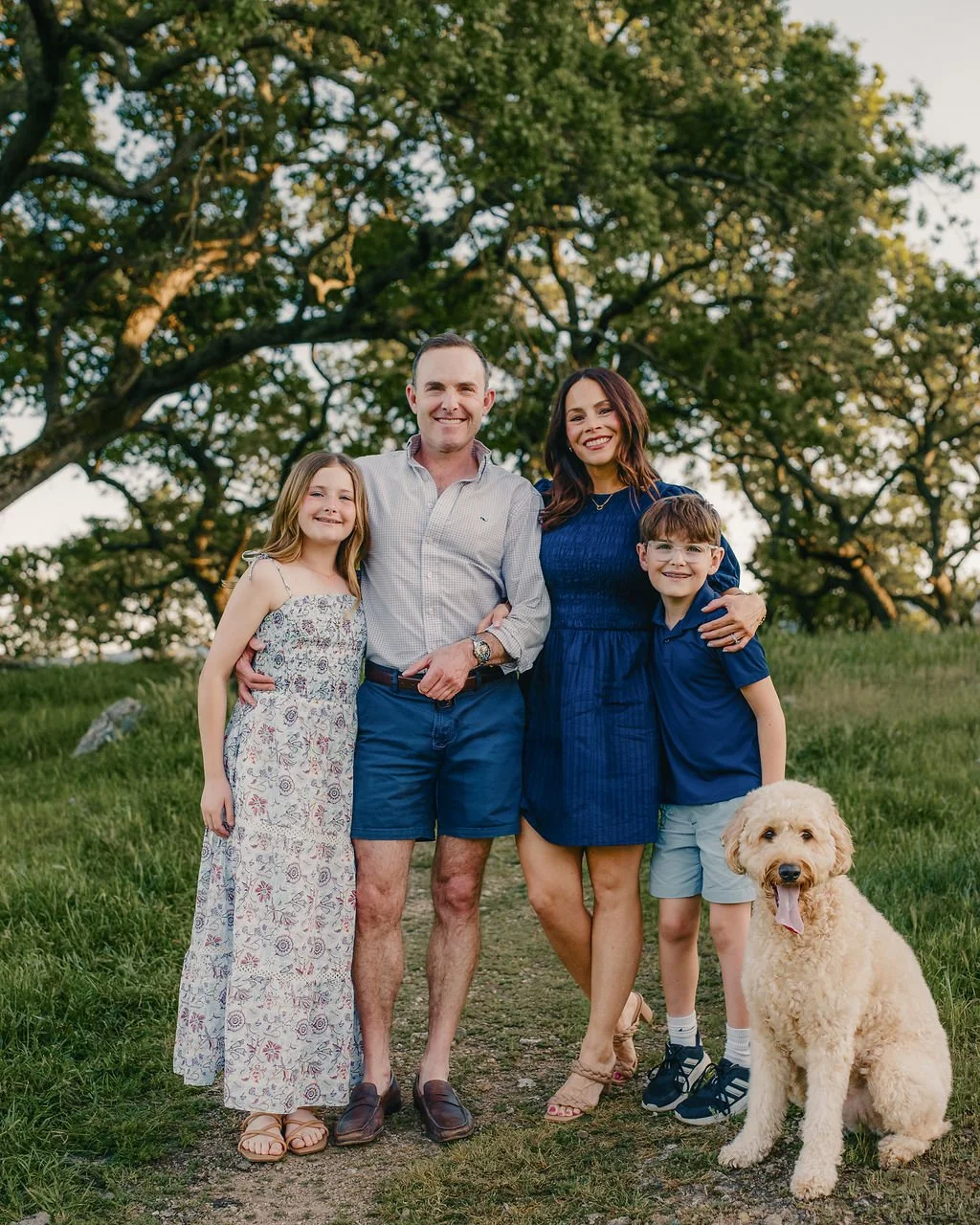 family-and-dog-posing-outdoors-natural-family-photos.jpg