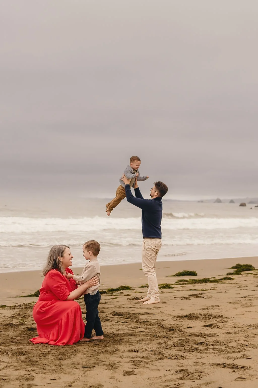 family-playing-together-on-beach-outdoor-family-session.jpg