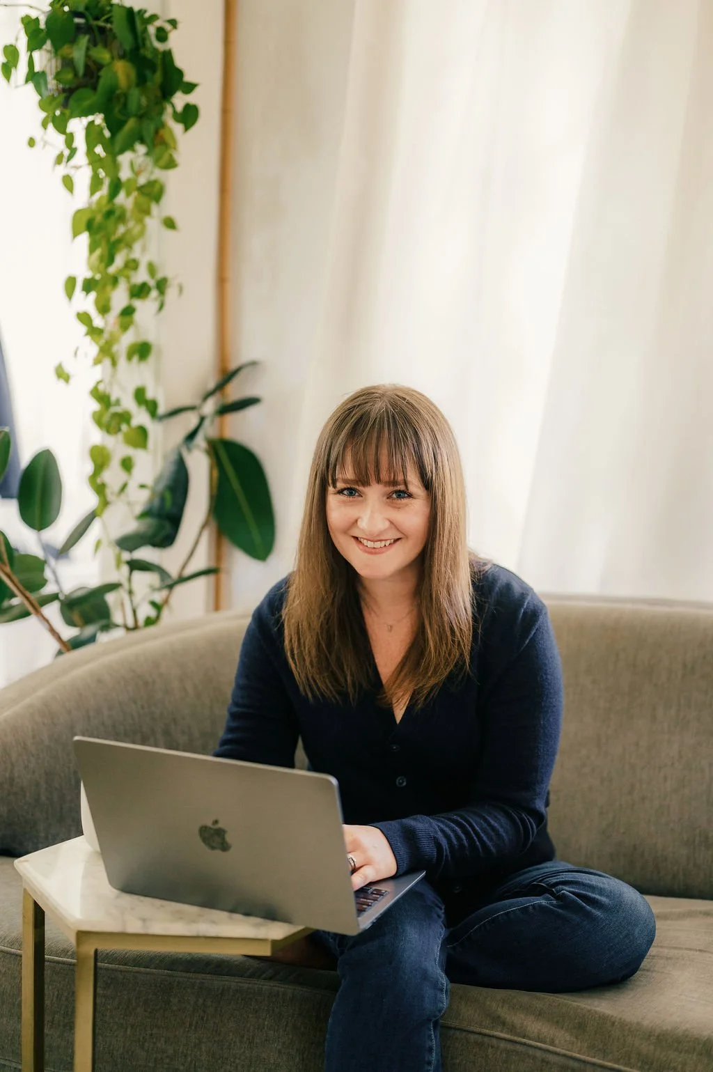 woman-sitting-on-couch-corporate-headshots-and-branding.jpg