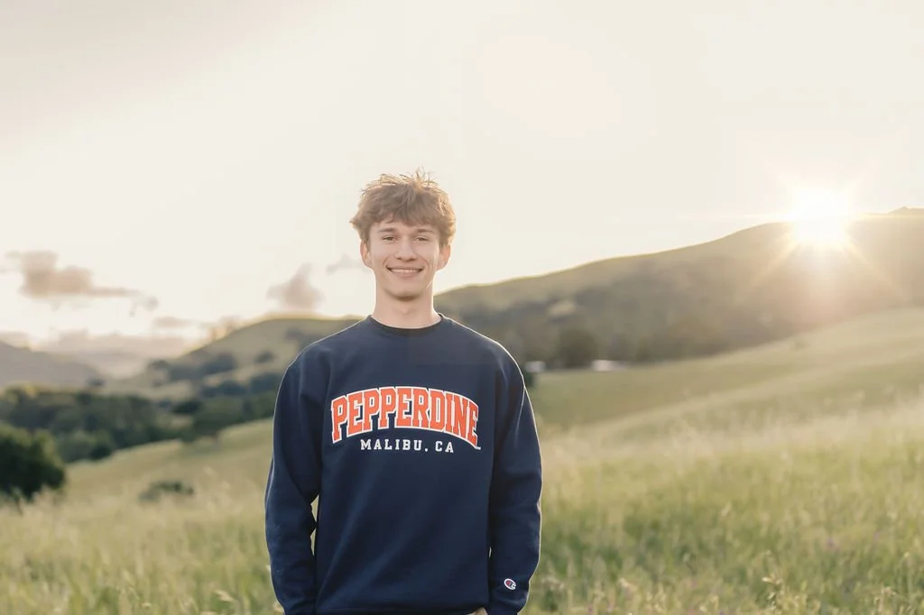young-man-smiling-outdoors-creative-senior-photos.jpg
