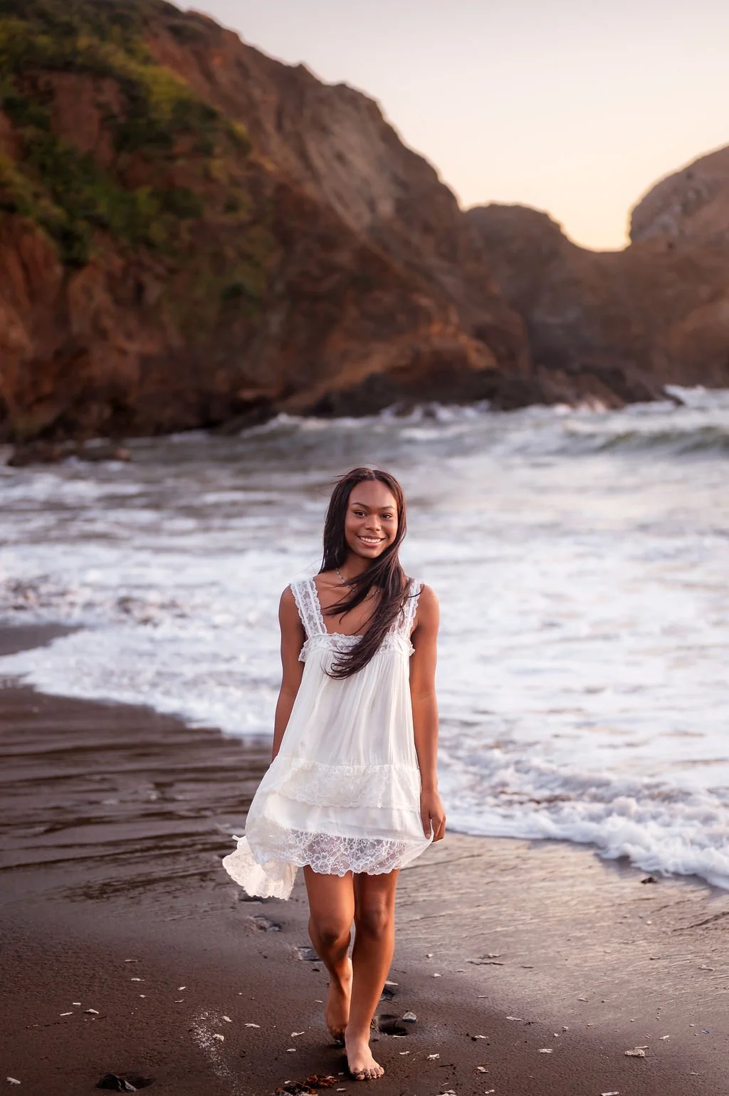 young-woman-walking-barefoot-high-school-senior-photos.jpg