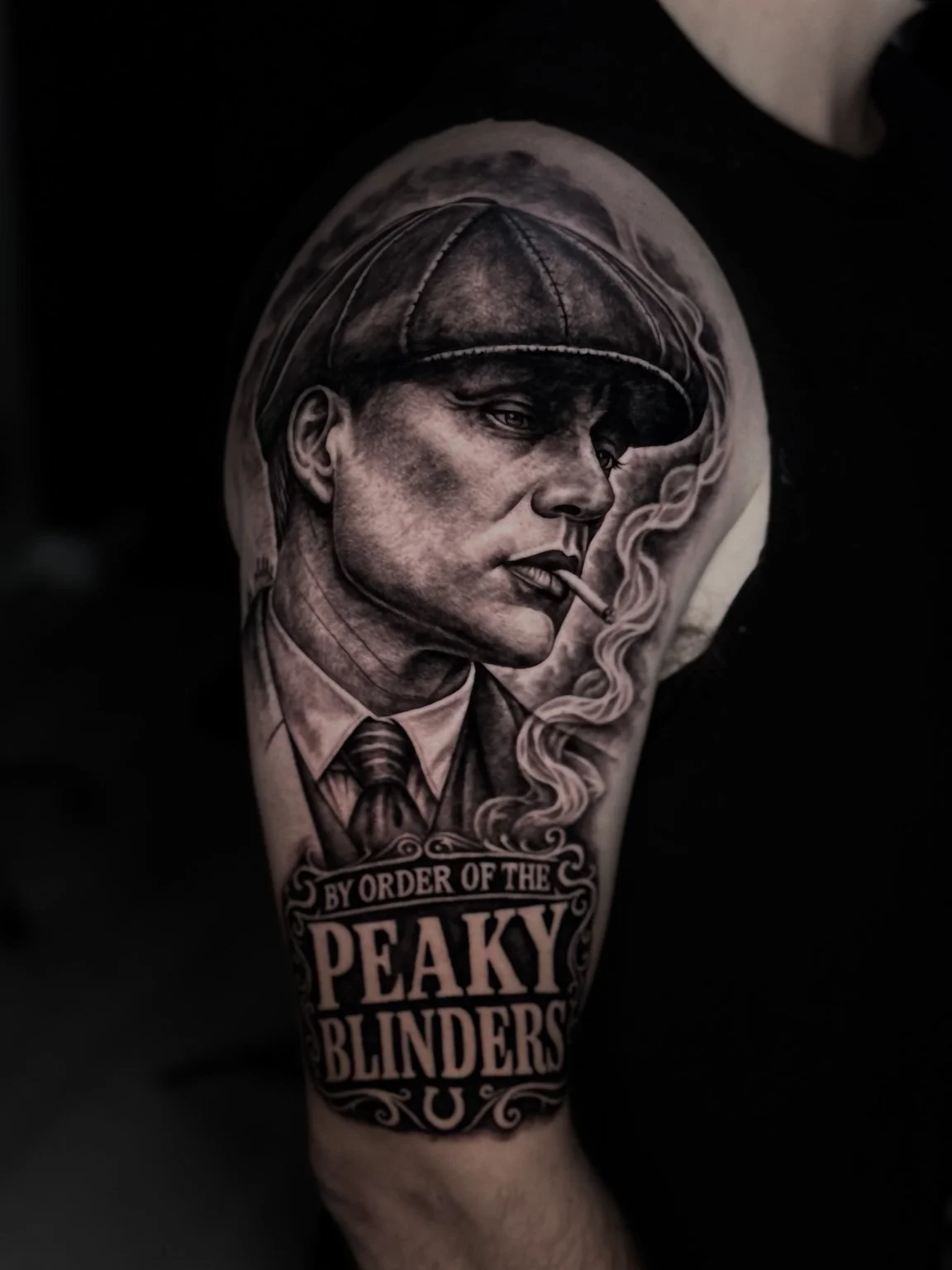 Black and grey Peaky Blinders portrait tattoo by Alina Horobets, Bournemouth