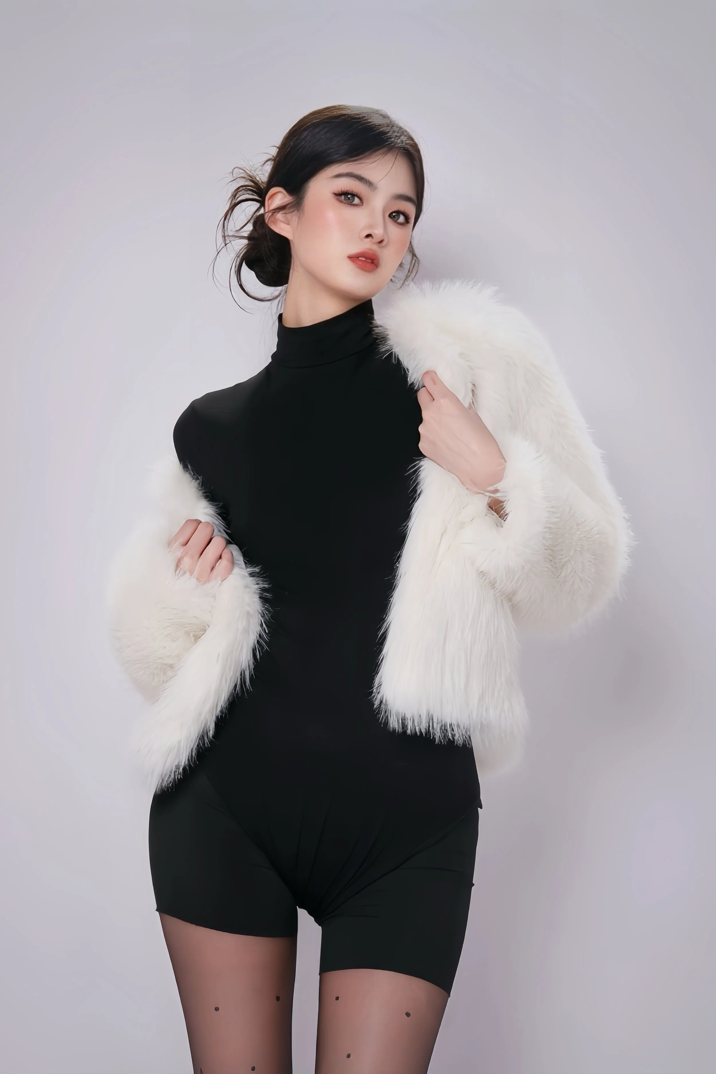 minimalist corporate headshot of woman in black bodycon for linkedin profile photo in singapore