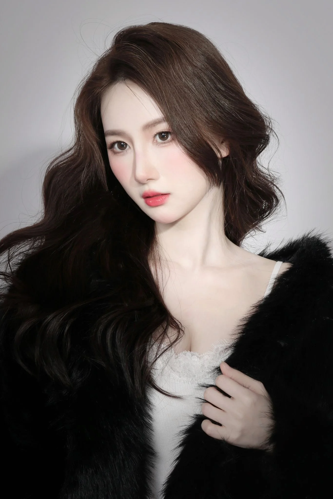 Moody aesthetic portrait of a woman with contrast lighting and feminine makeup