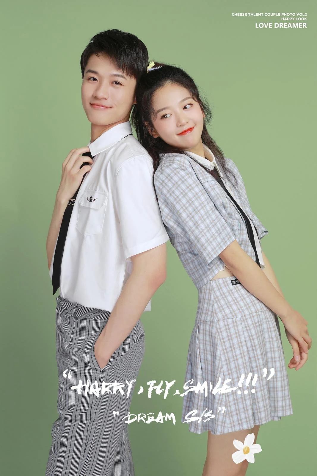 Young couple in campus style uniform outfit posing in studio photoshoot