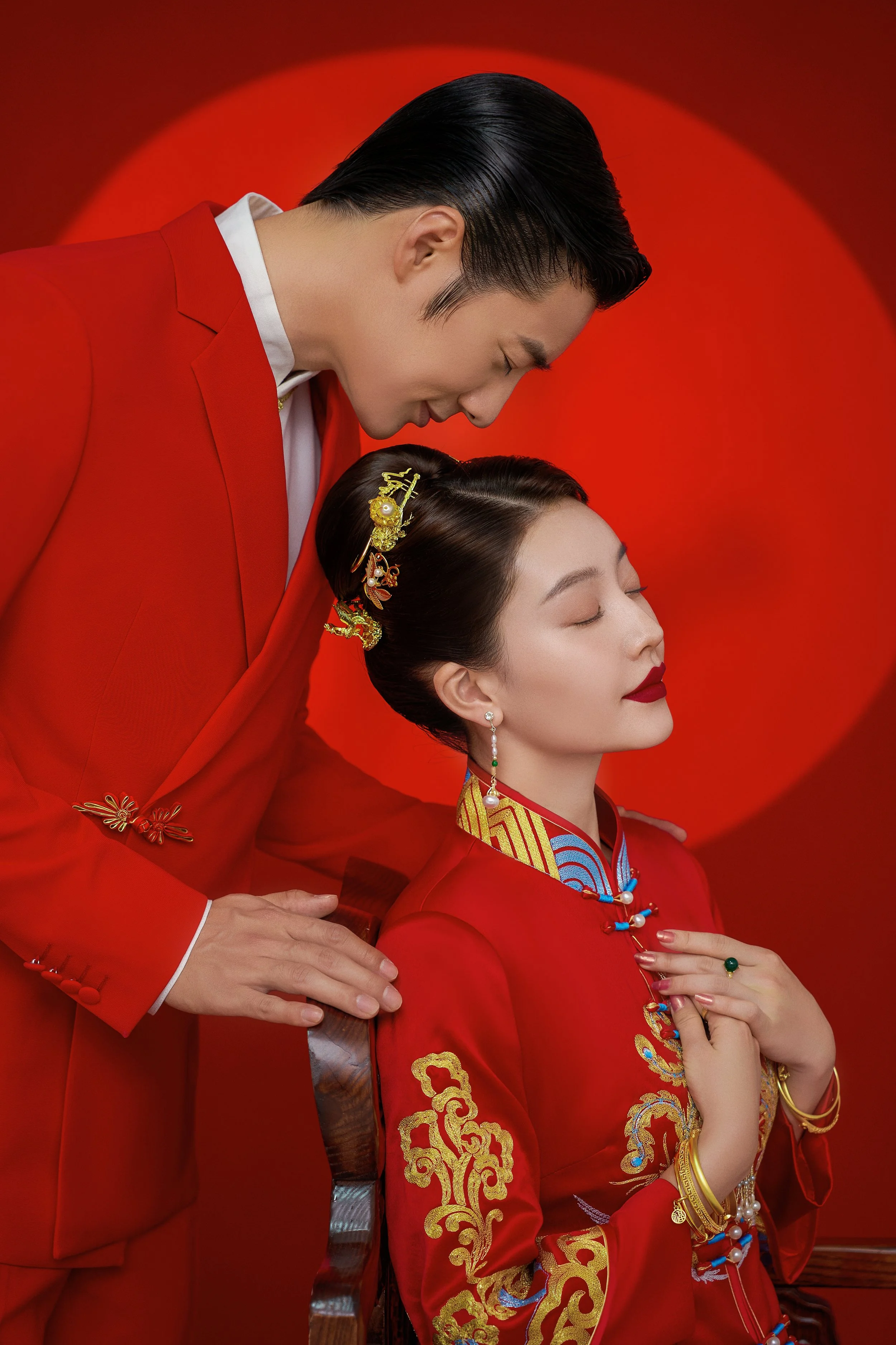Auspicious traditional Chinese pre-wedding photoshoot in studio with red background