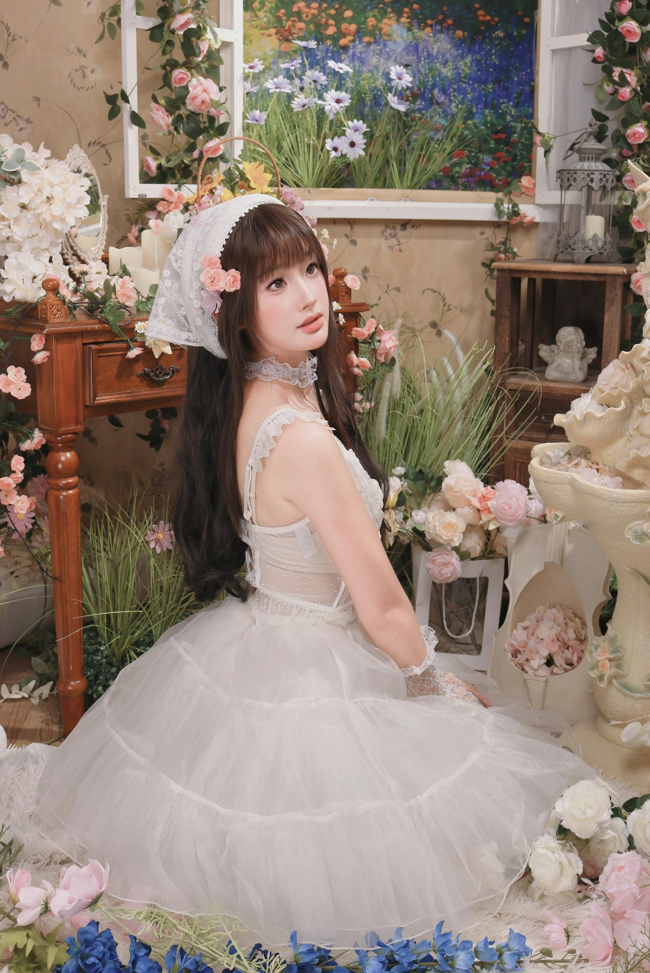 woman wearing white coquette dress photoshoot in portrait studio in singapore