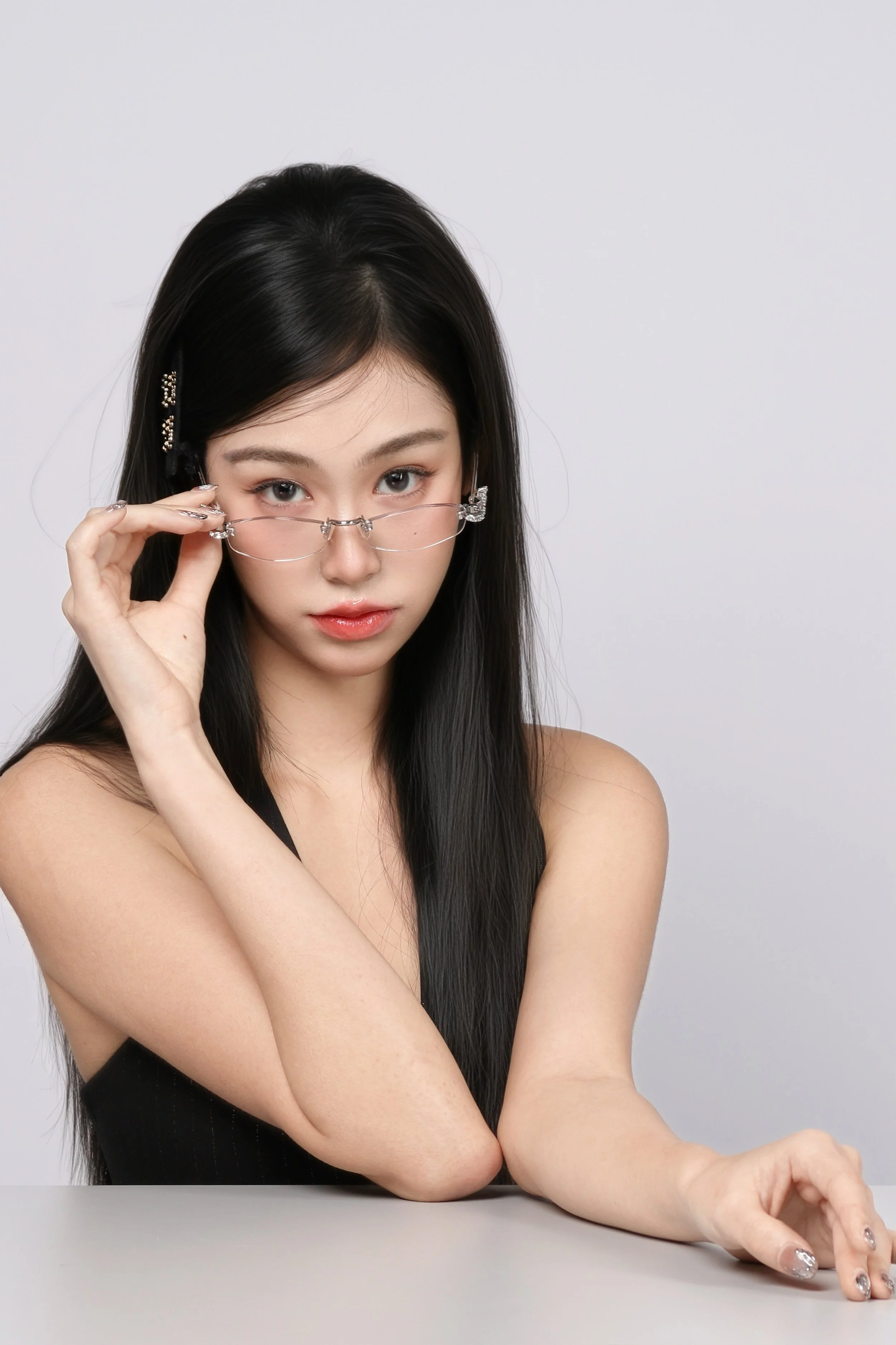 Clean background portrait of a woman wearing glasses