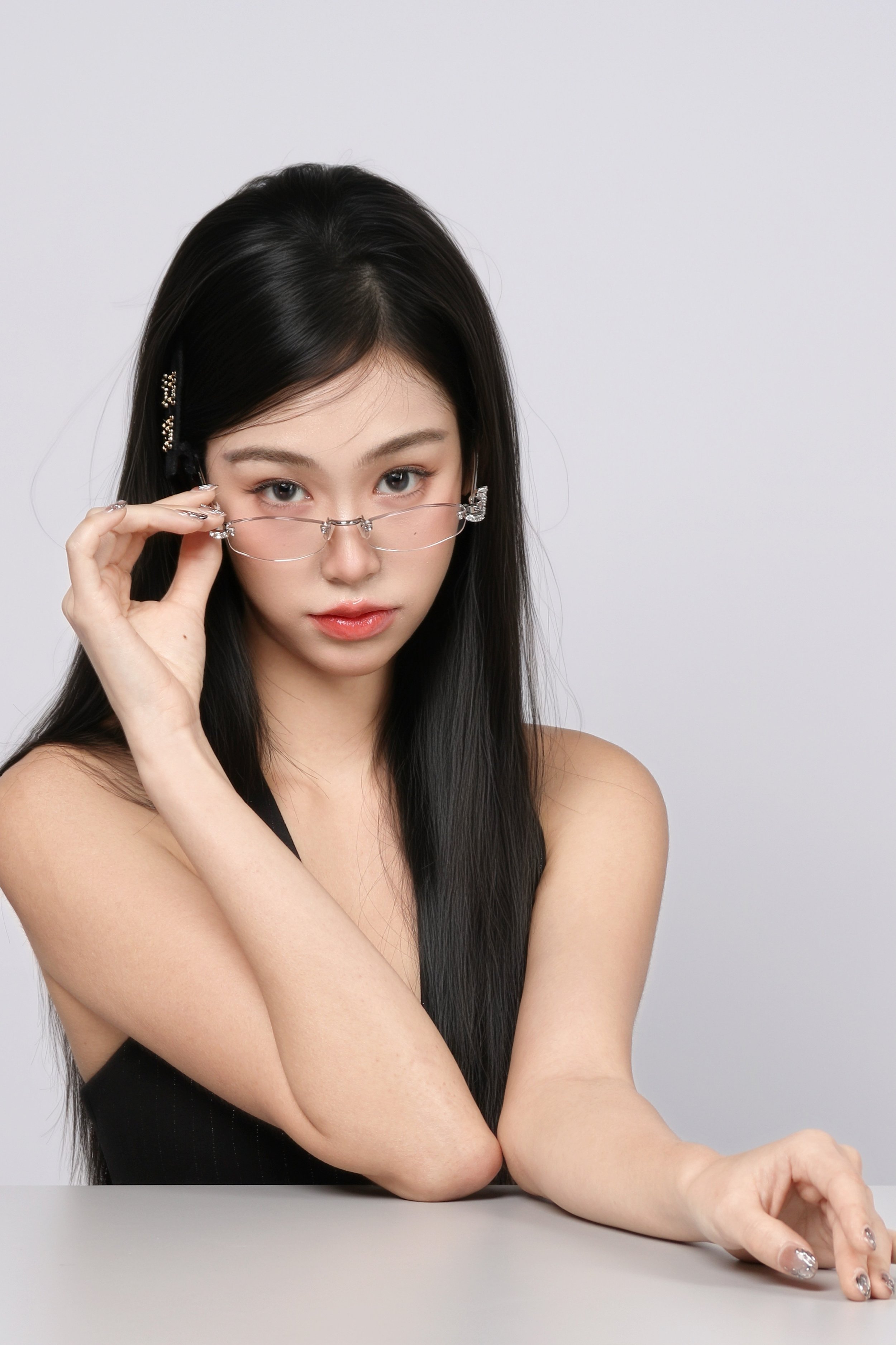 Clean background portrait of a woman wearing glasses
