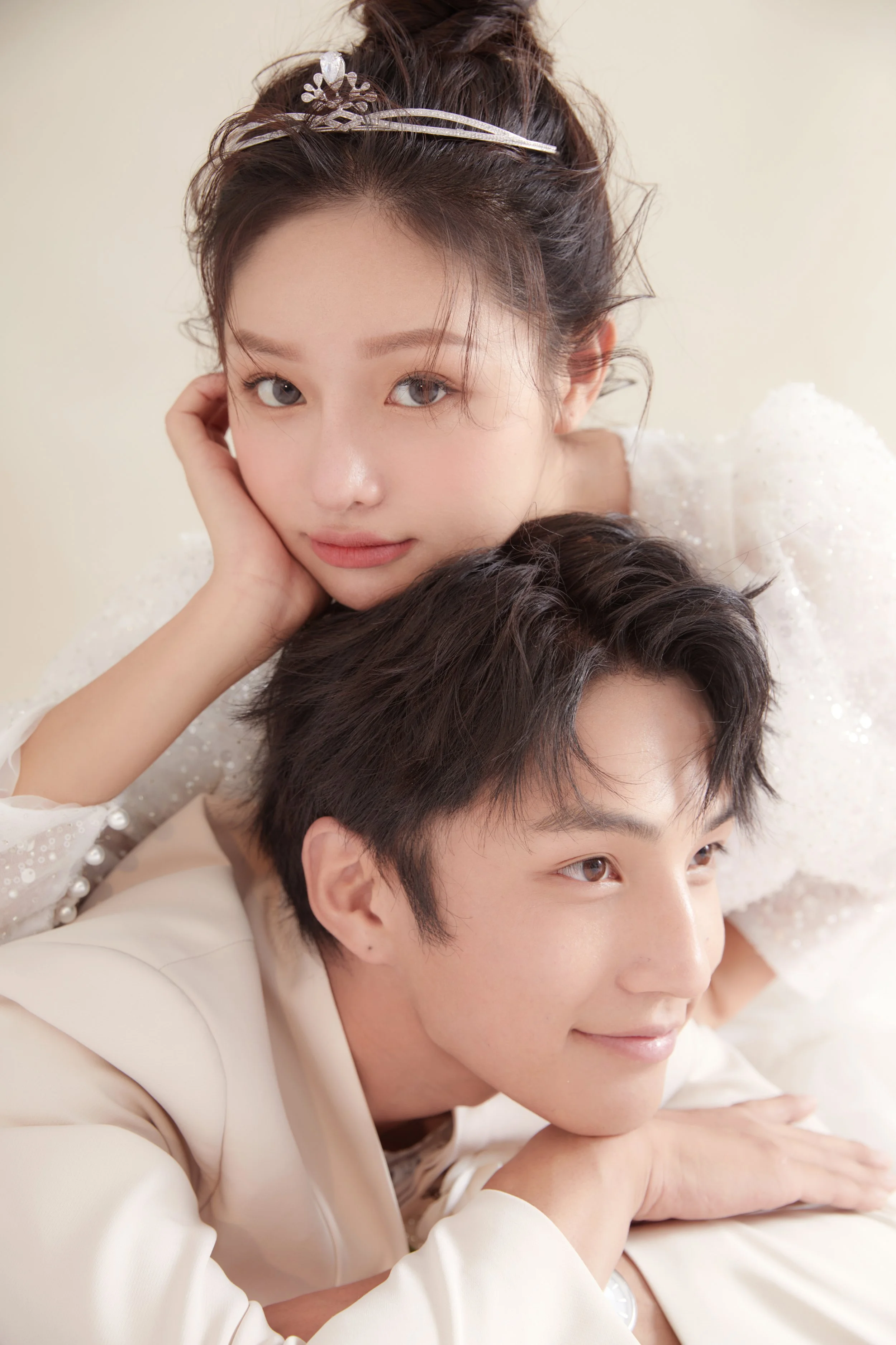 Close-up of a young Asian couple in Western white wedding outfit taking pre-wedding photoshoot