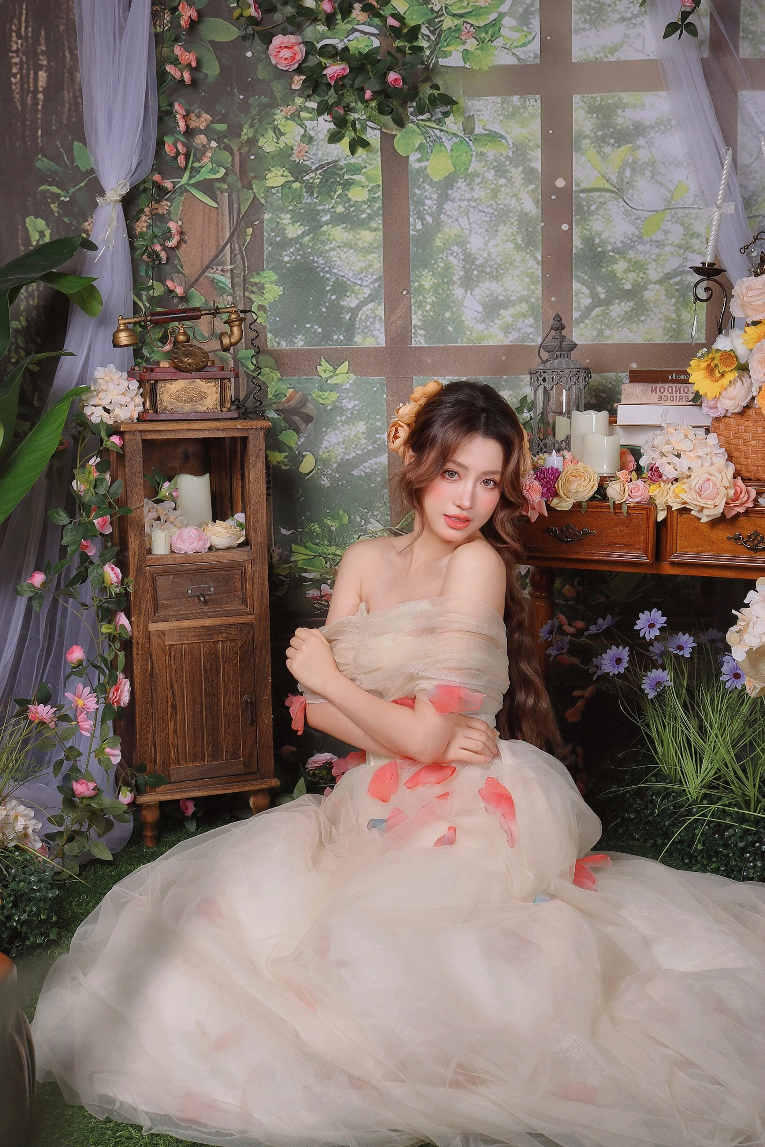 woman in floral princess dress taking fantasy photoshoot in photo studio in singapore