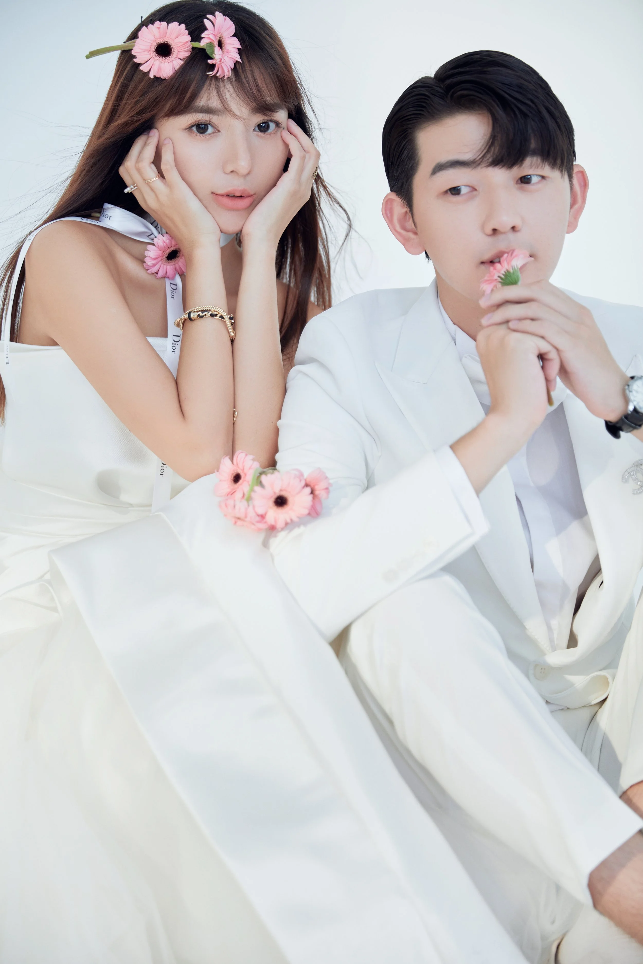 Pre-wedding photoshoot of a young Asian couple in full white Western outfit