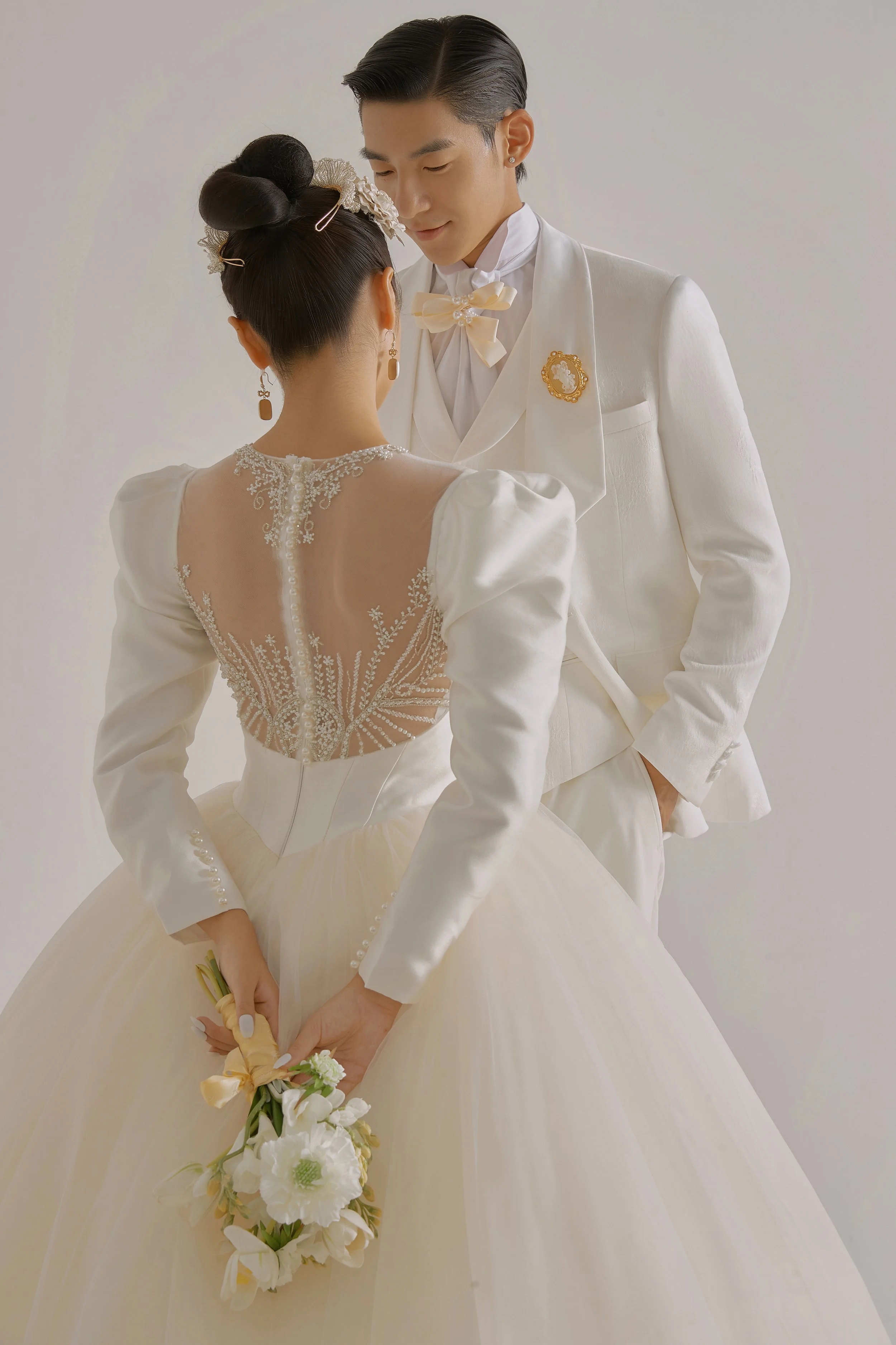 Romantic pre-wedding photoshoot of an Asian couple in a photo studio