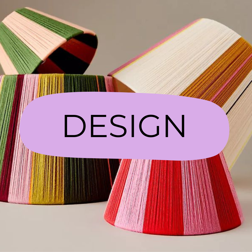 Colorful handmade and crafted lamps,  with the word 'DESIGN' in a purple oval overlay.