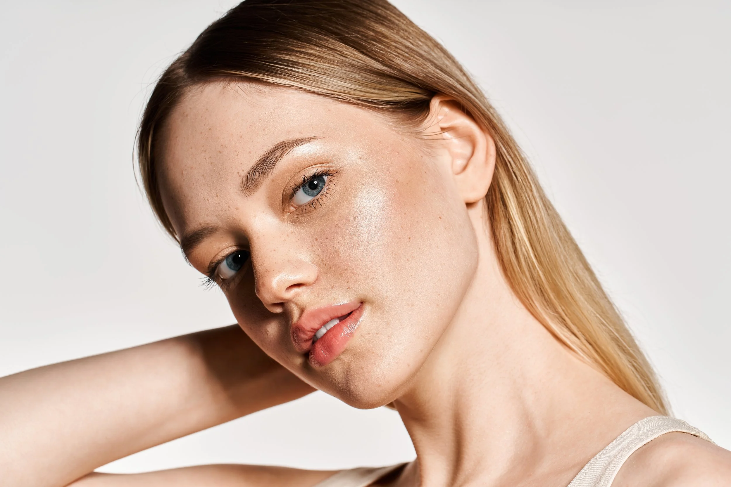 Caucasian woman with bright, healthy skin representing microneedling benefits.