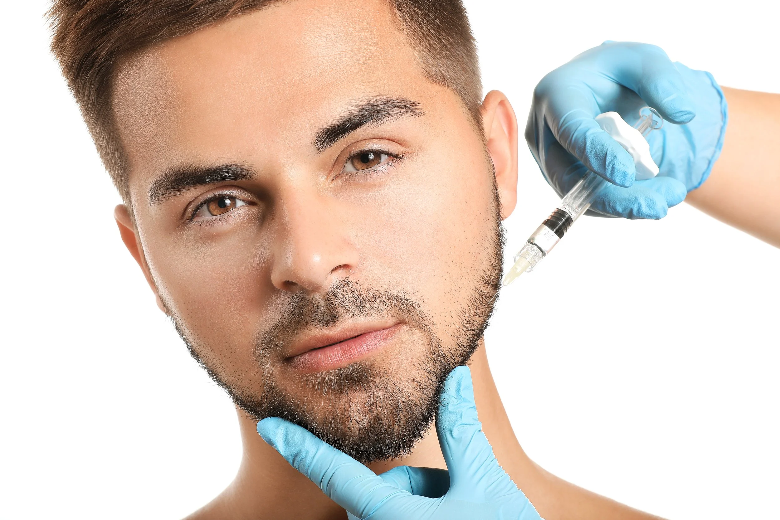 Male model receiving precise jawline filler injection administered by a professional with gloved hands.