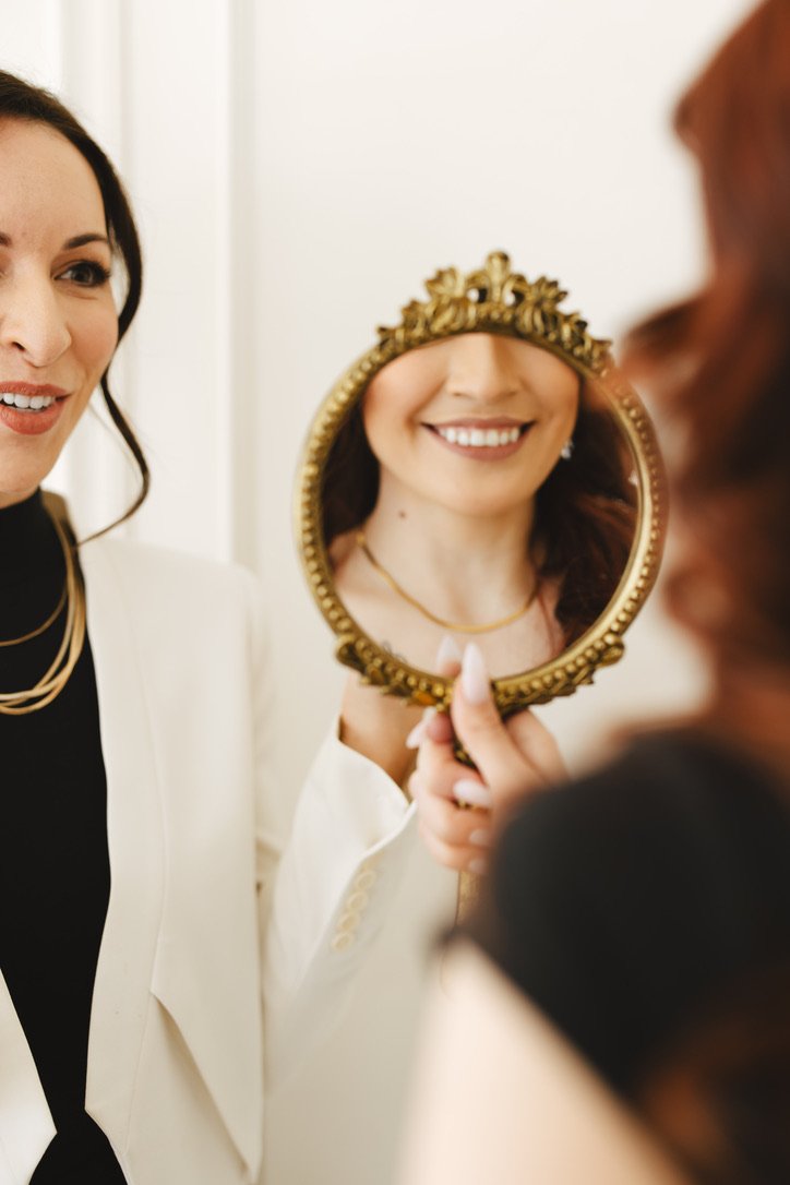 Dr. Brittany Dickinson reviewing a smile design preview with a patient during a Smile Design Consultation at Chicago Aesthetic Dentistry in Lakeview, Chicago.