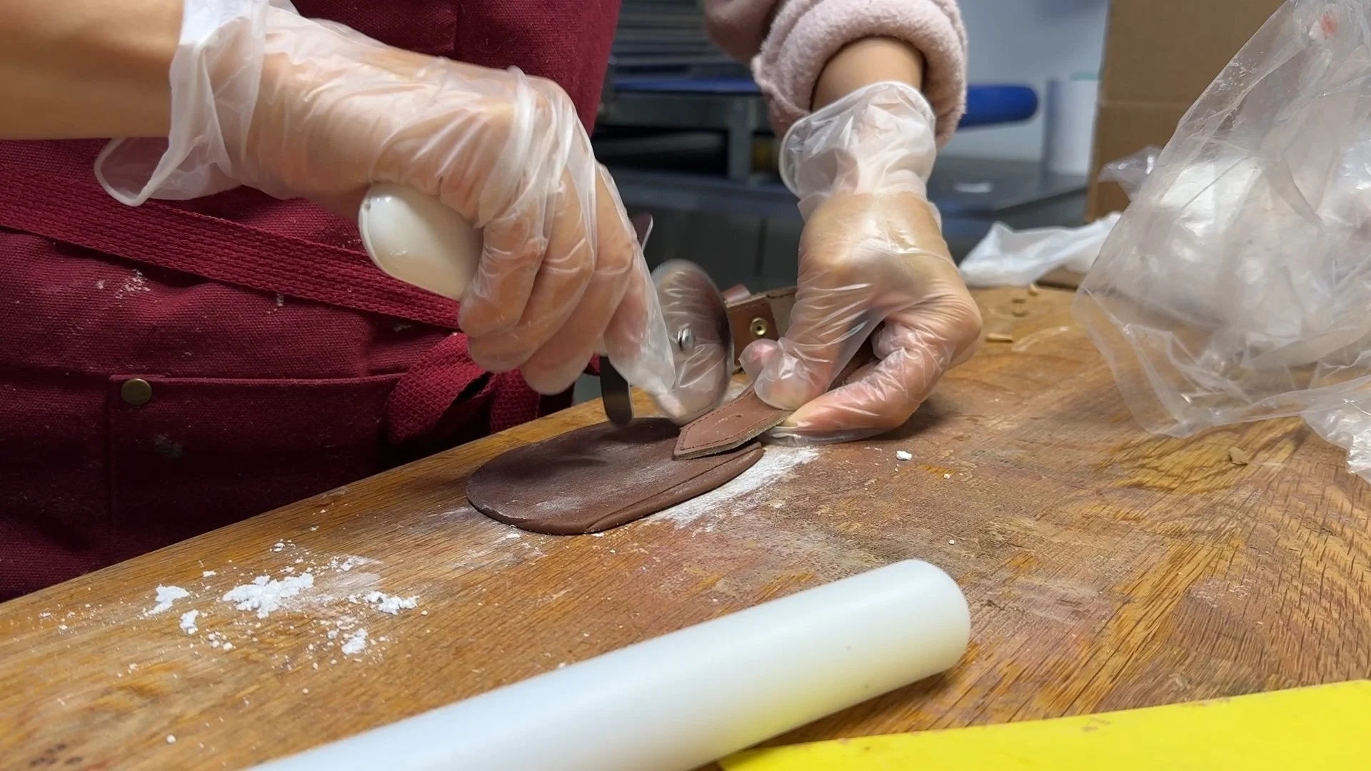 Michelle Wibowo cutting the sugar paste to make a leather strap